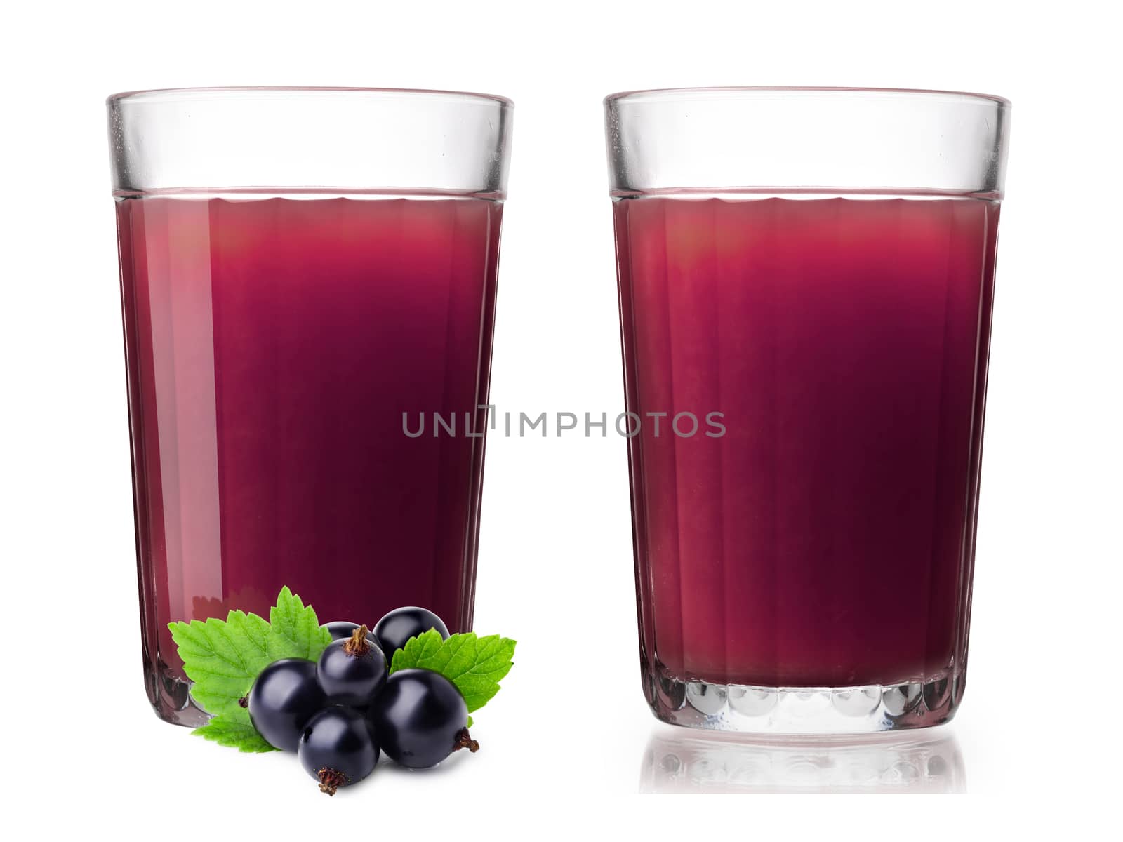 Faceted glasses (highballs) with blackcurrant smoothie. One glass alone, one with berries on foreground. Separate clipping paths for each glass, for berries and for shadows
