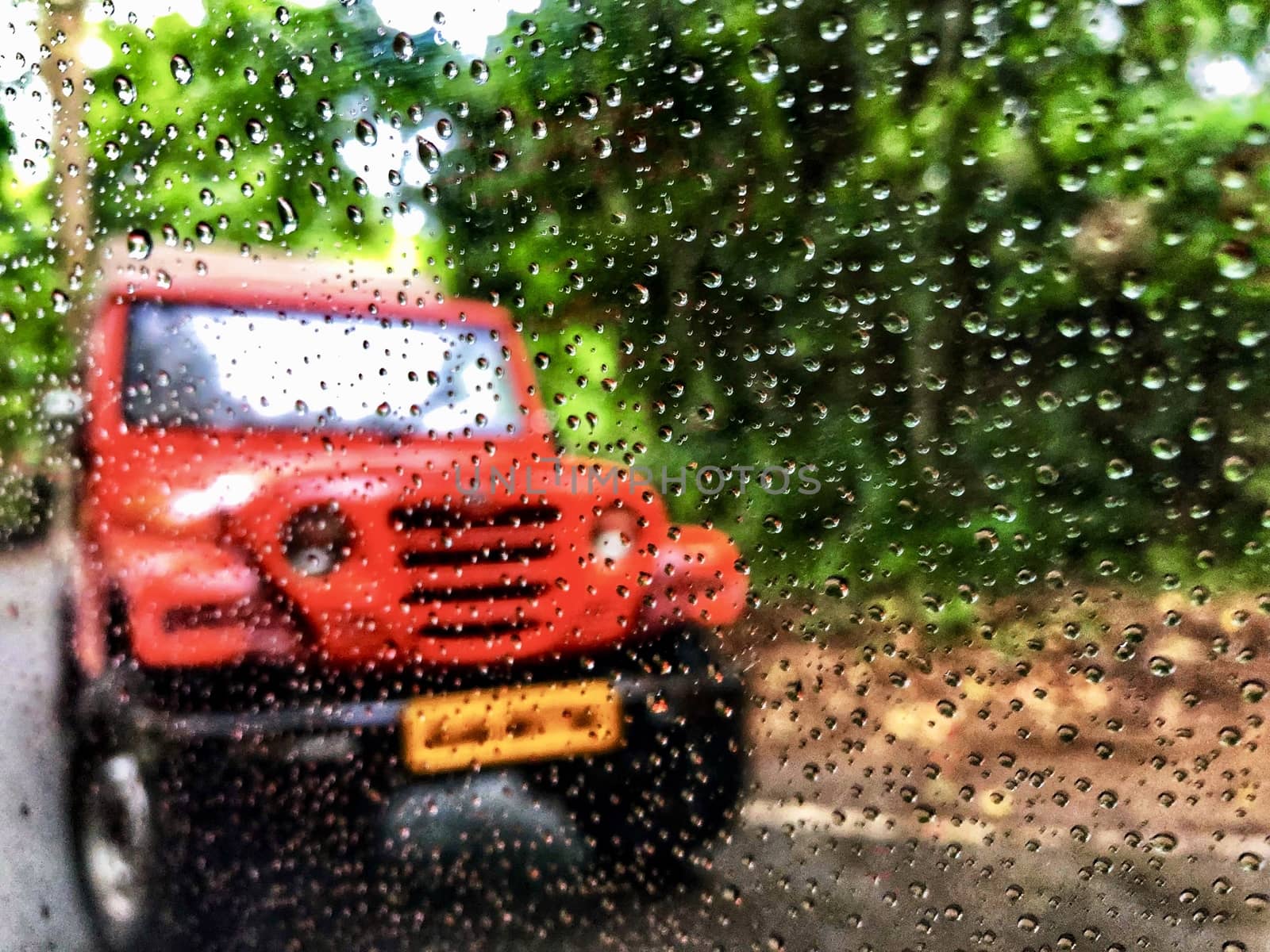 Beautiful view of raindrops and blurred natural view in the background
