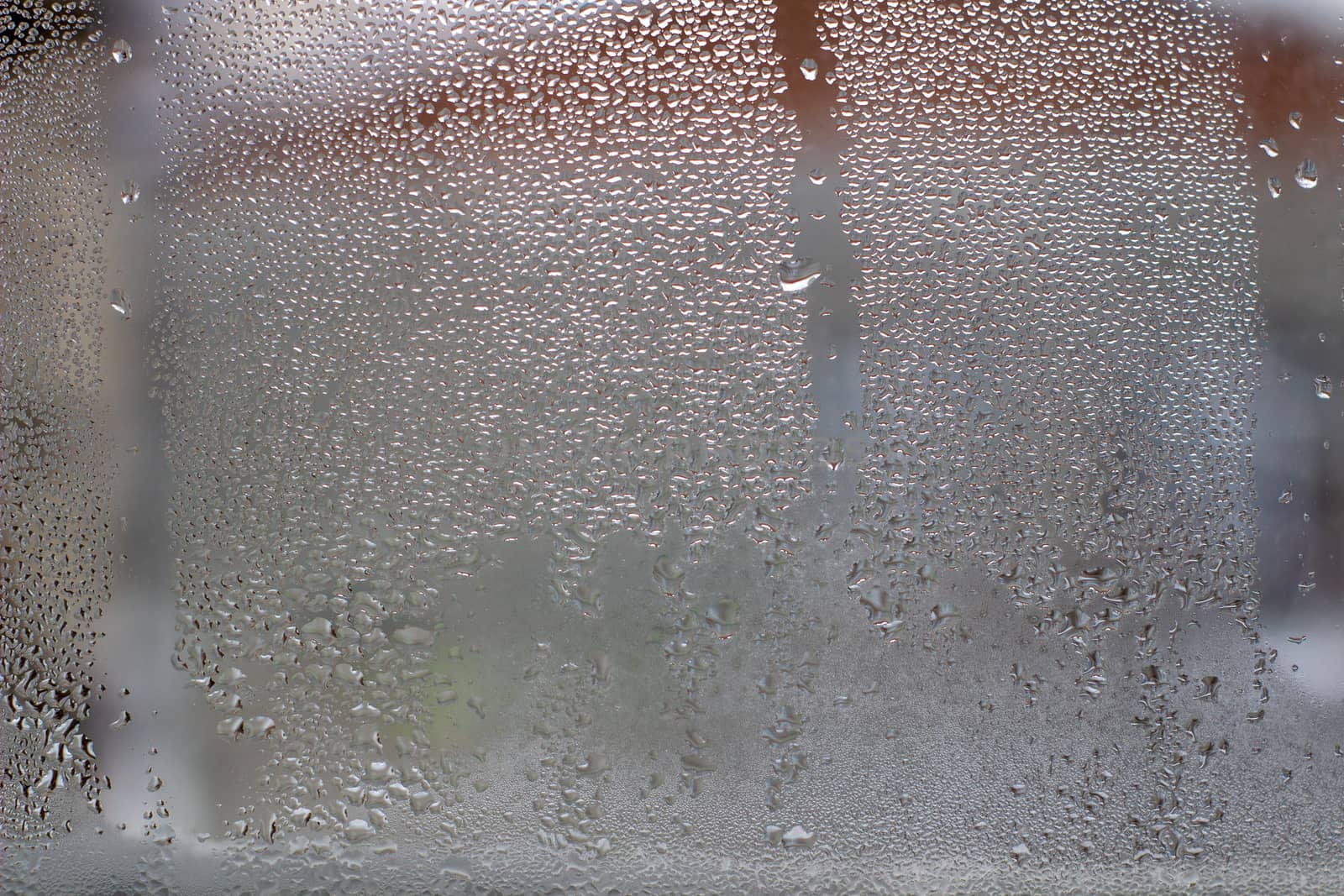 Close-up clear drops of water on window glass surface by AnatoliiFoto