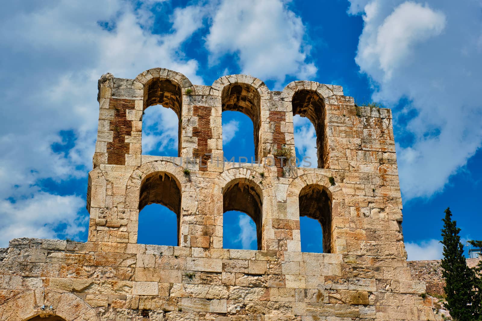 Ruins of Odeon of Herodes Atticus ancient stone Roman theater located on the southwest slope of the Acropolis hill of Athens, Greece. Athens, Greece