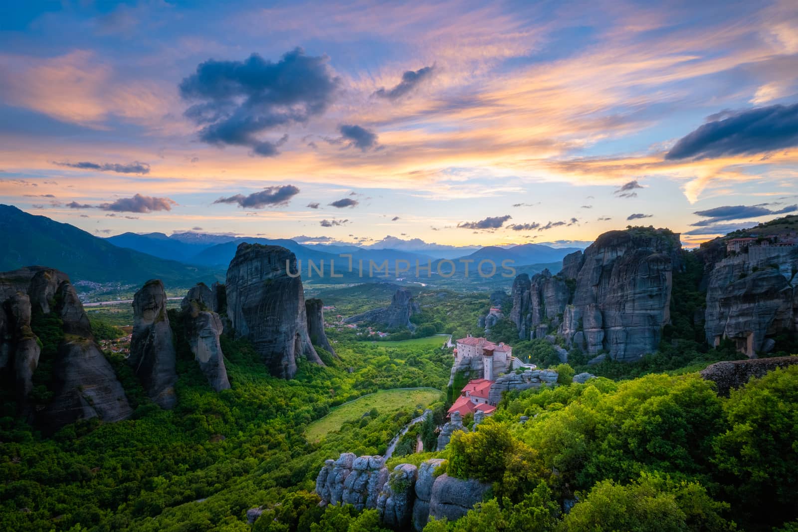 Sunset sky and monasteries of Meteora by dimol