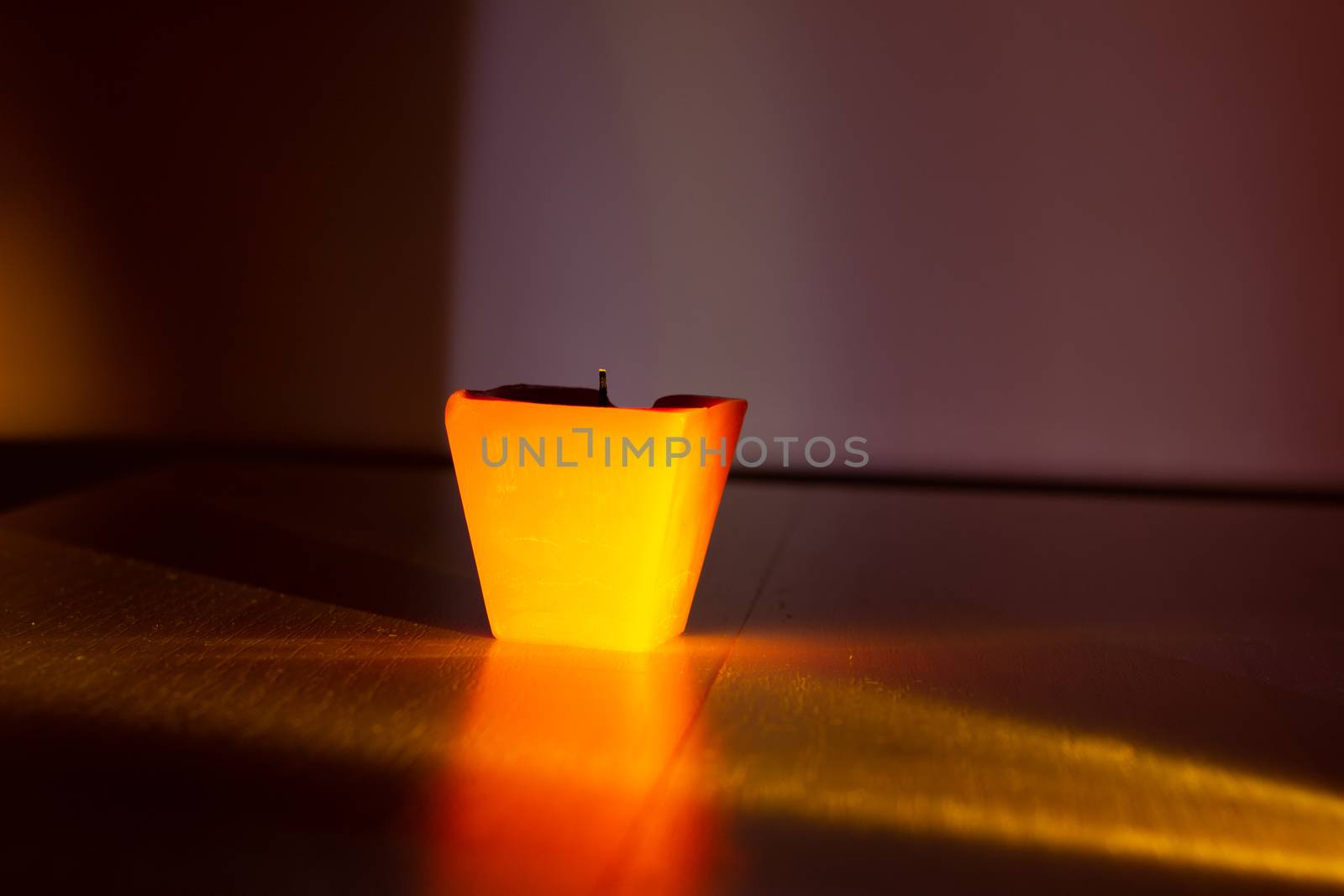 Extinguished candle on black background with copy space.