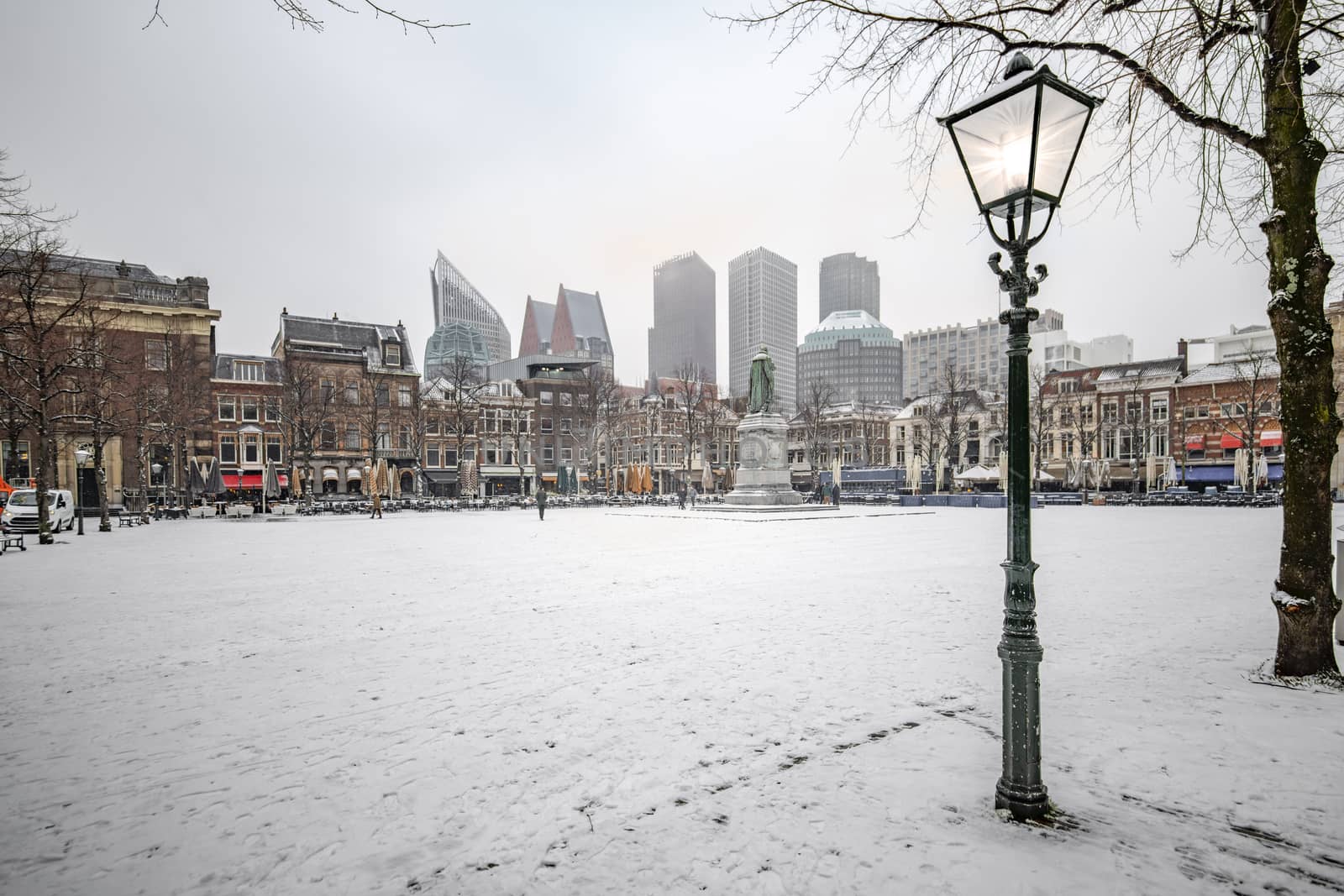 THE HAGUE, 22 January 2019 -  Snow on the central place, Spui in Dutch, usually crowded with people getting diner and drink during the sunset and warm autumn weather in The Hague, Netherlands by ankorlight