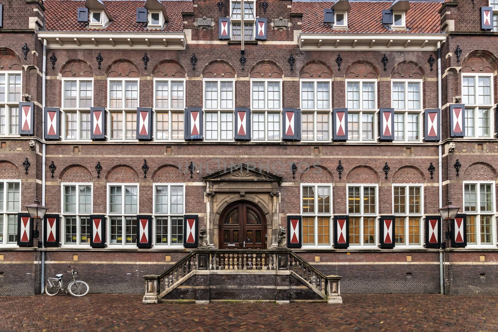 Flemish architecture school brick facade with a bicycle parking in front, Amsterdam, Netherlands