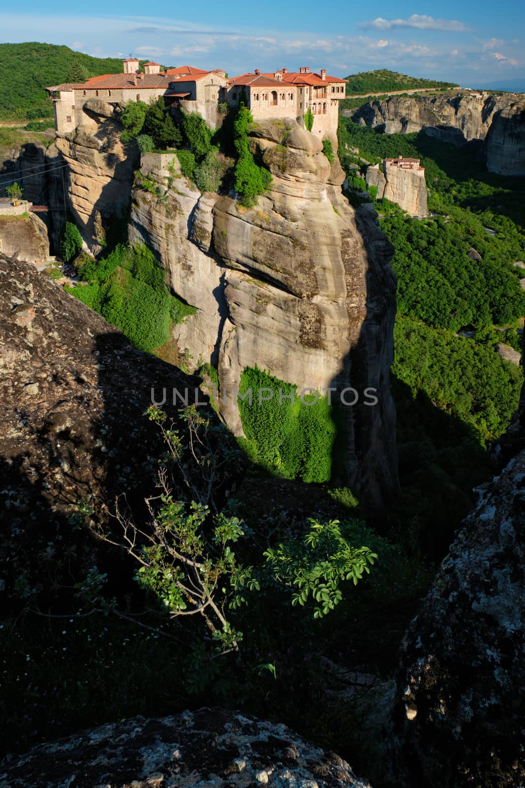 Monastery of Varlaam and Monastery of Rousanou in famous greek tourist destination Meteora in Greece on sunset with scenic scenery landscape