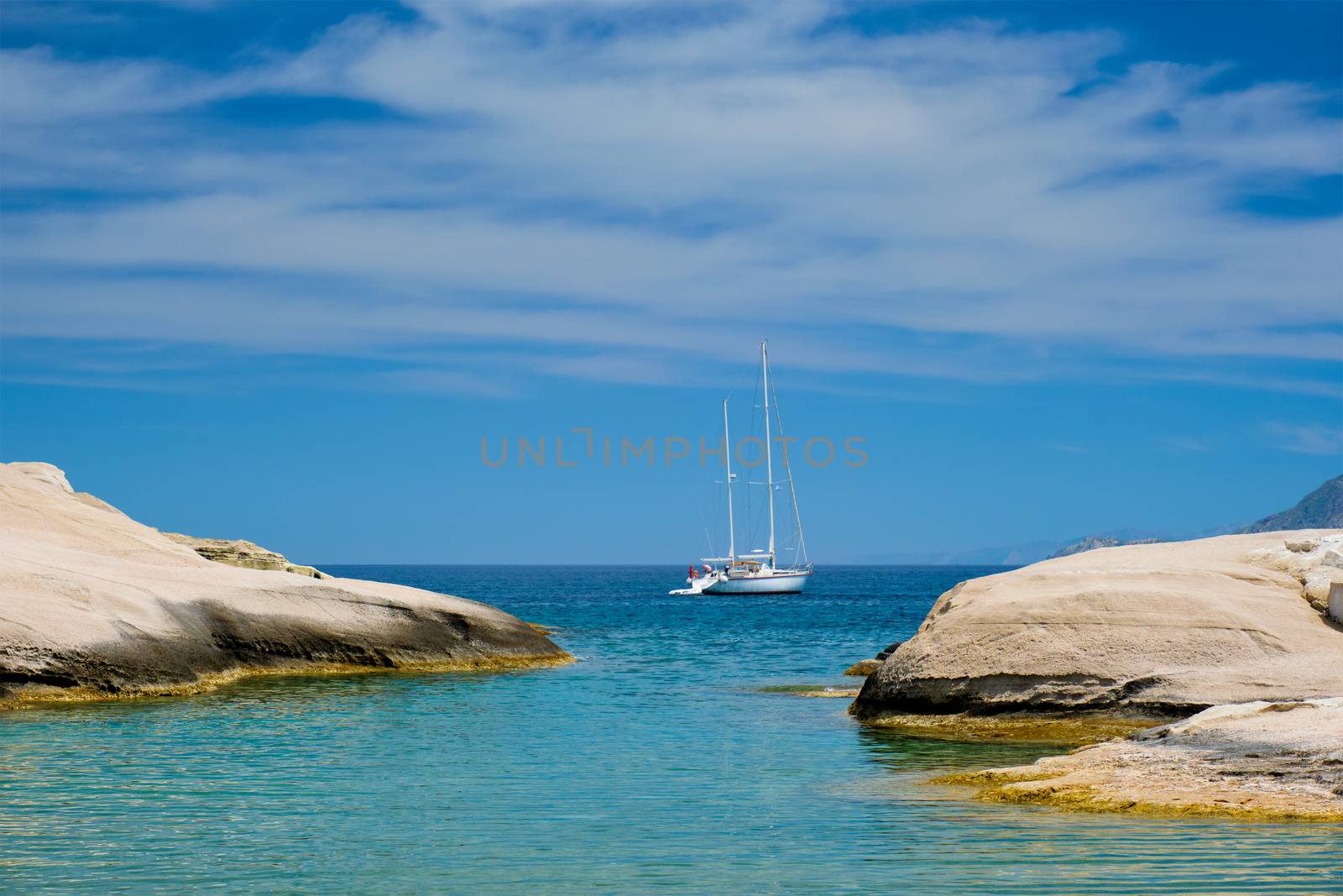 Yacht boat at Sarakiniko Beach in Aegean sea, Milos island , Greece by dimol
