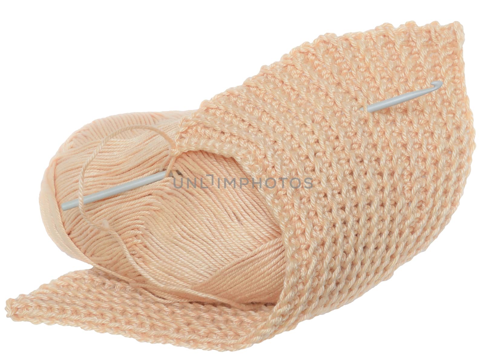 Handmade crochet yarn beige color isolated on a white background.