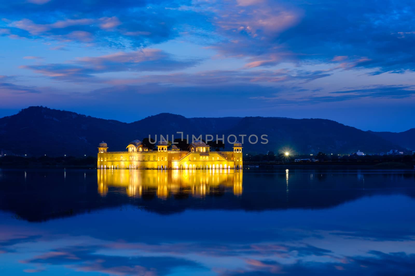 Rajasthan famous tourist landmark - Jal Mahal Water Palace on Man Sagar Lake in the evening in twilight. Jaipur, Rajasthan, India