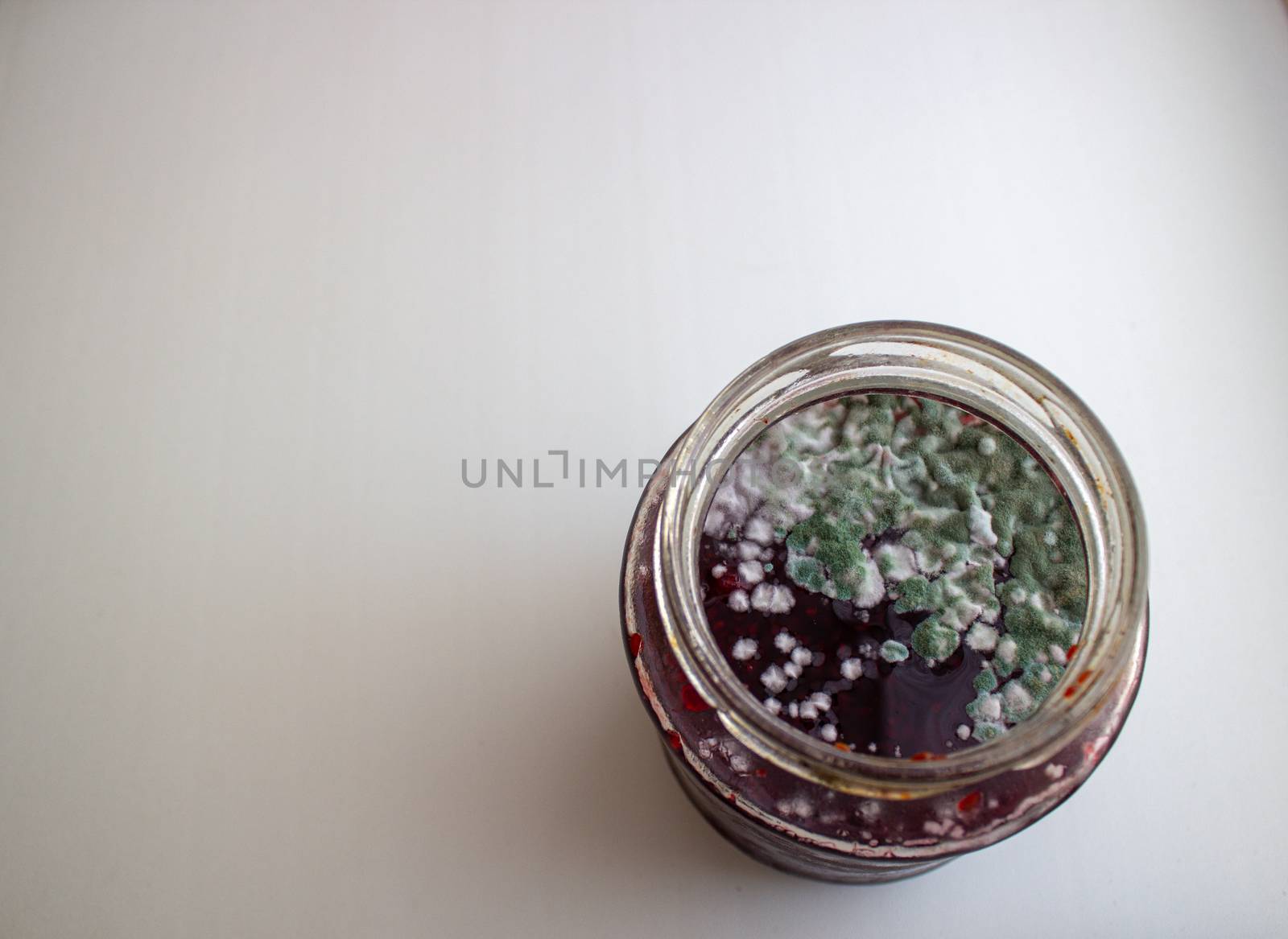 Mold in a jar of jam. Hazardous to health. Mold. by AnatoliiFoto