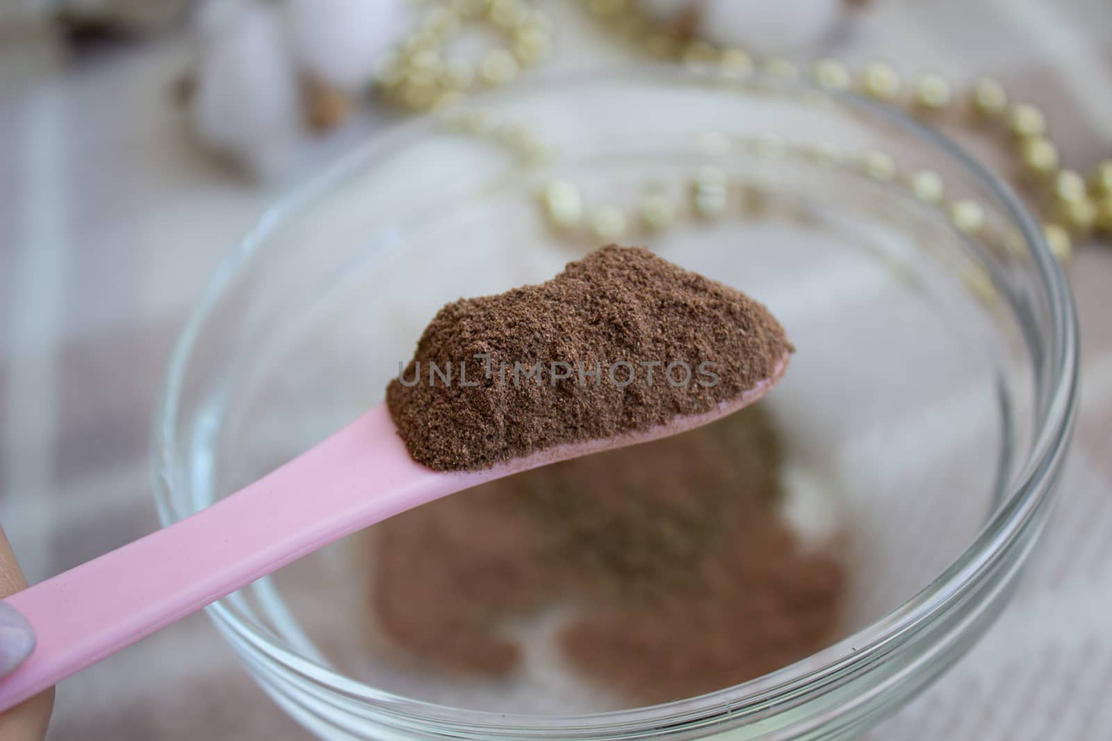 Close up of raw Henna powder used for natural color dyeing. by AnatoliiFoto