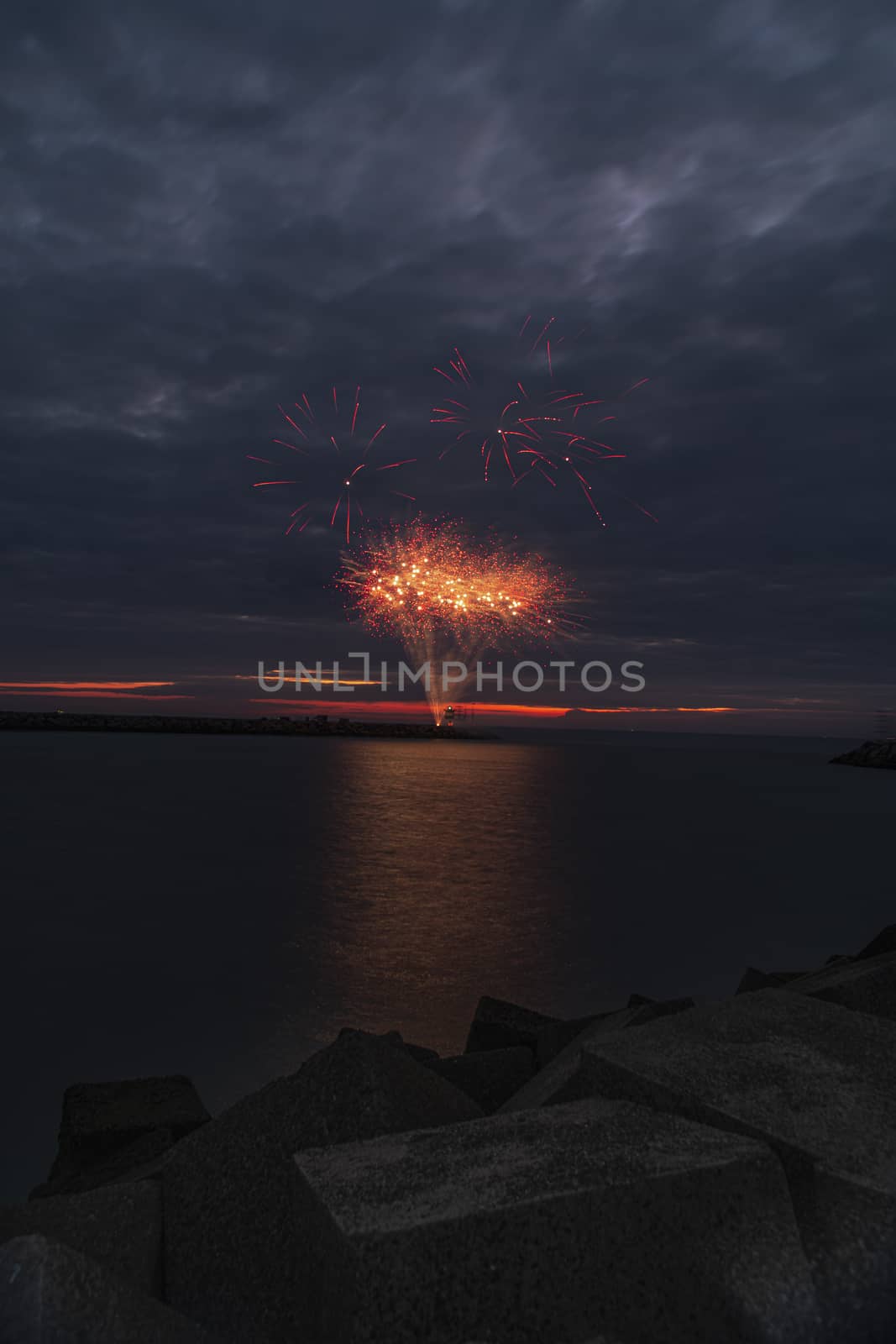 Fireworks launch at the pier of the Scheveningen harbor celebrating the Tall Ship Regatta in The Hague, Netherlands by ankorlight