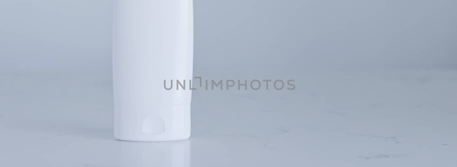 Blank label cosmetic container bottle as product mockup on gray background, hygiene and healthcare