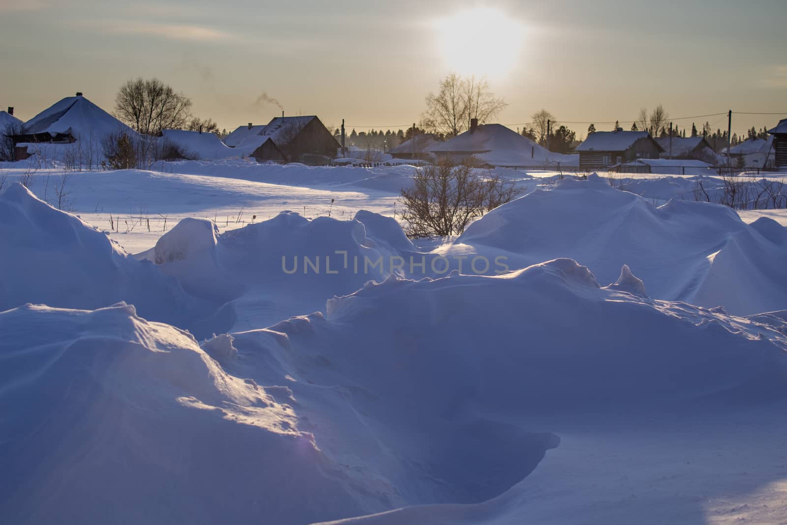 Snow drifts in winter. Winter kind. The snow at sunset. Much snow.