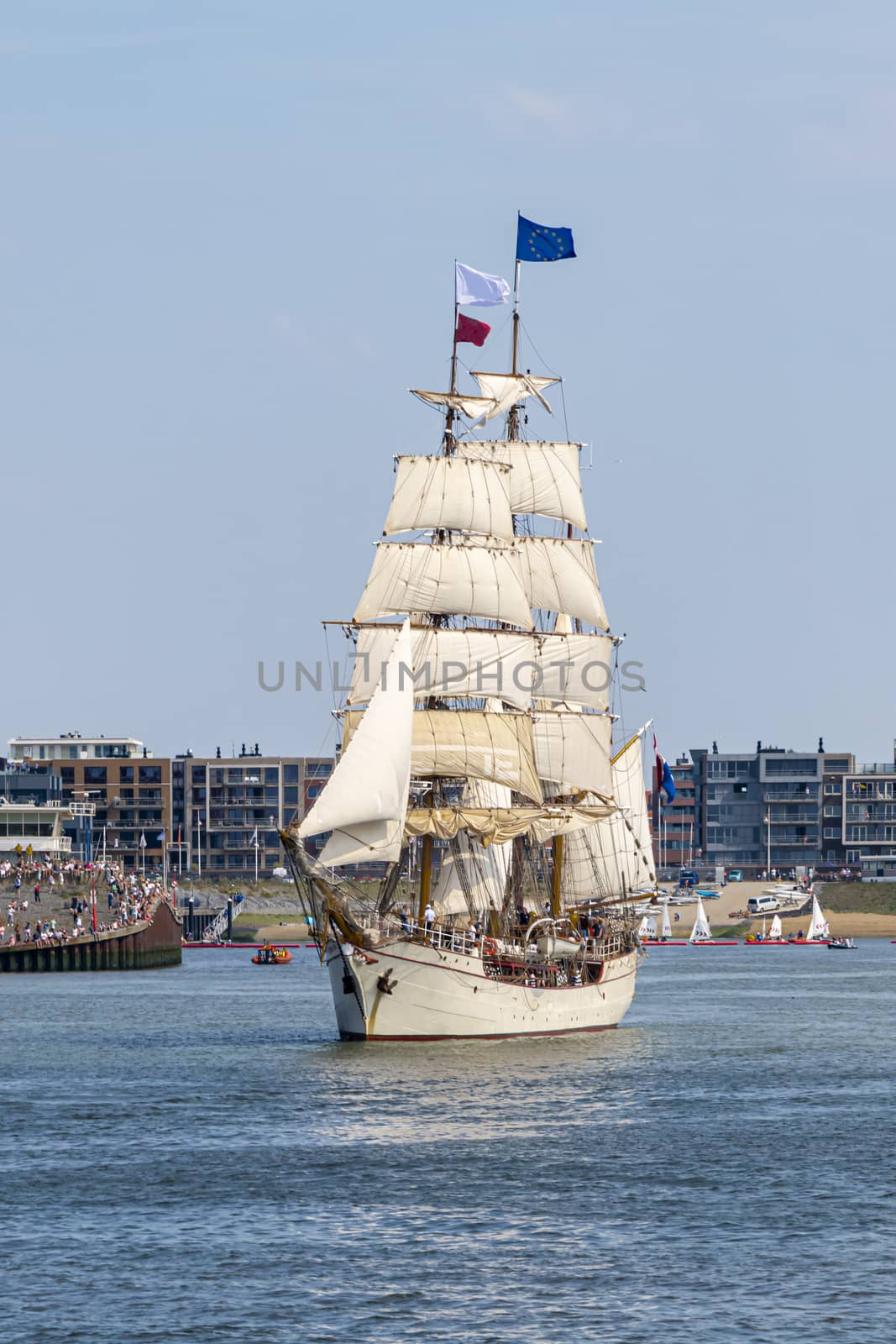 Antique tall ship, vessel leaving the harbor of The Hague, Scheveningen under a sunny and blue sky by ankorlight