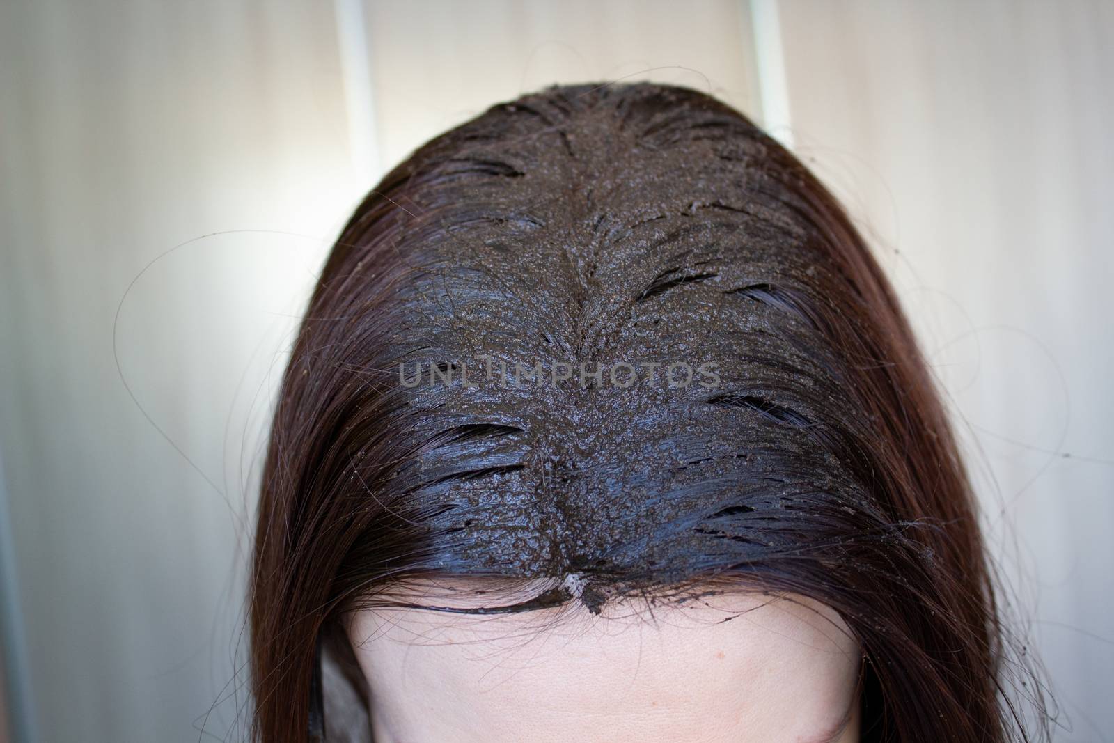 lifestyle woman paints henna gray hair, hair coloring self-care by AnatoliiFoto