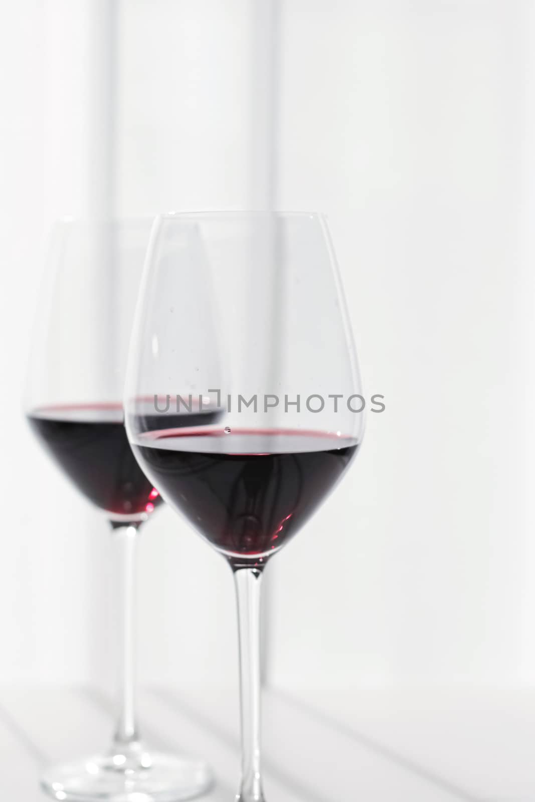 Two crystal glasses of red wine, organic beverage product