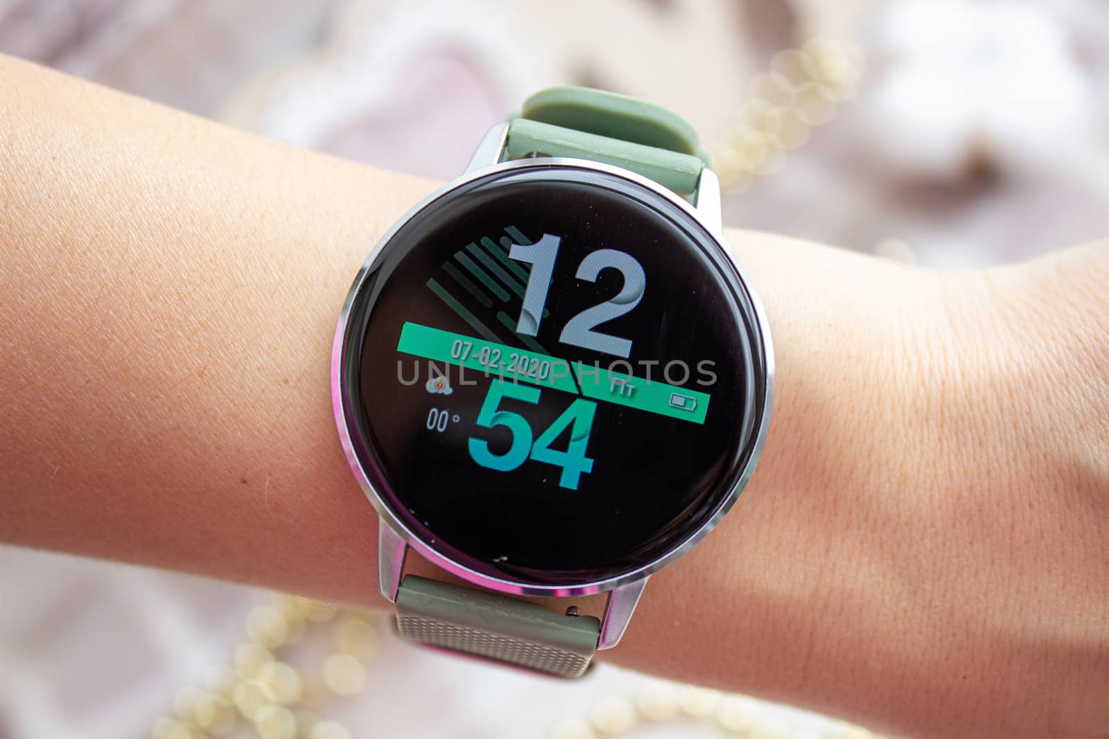 Digital watch with a large display on the girl s hand.