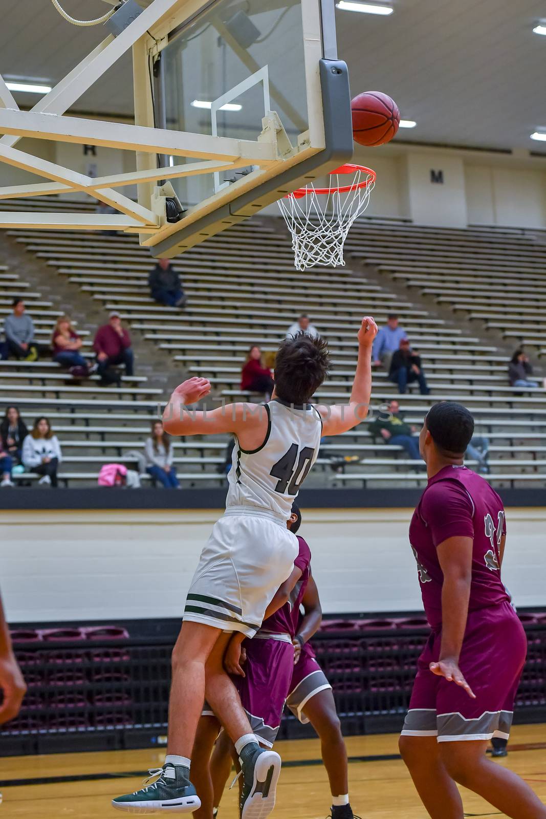 Basketball Players Making Spectacular Plays by Calomeni