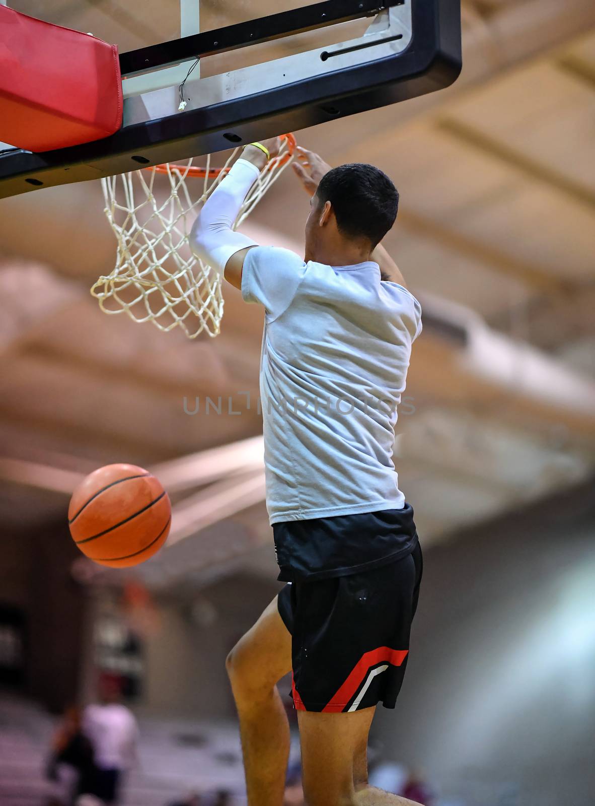 Young athletes making great basketball plays during a game. Slam Dunks and layups