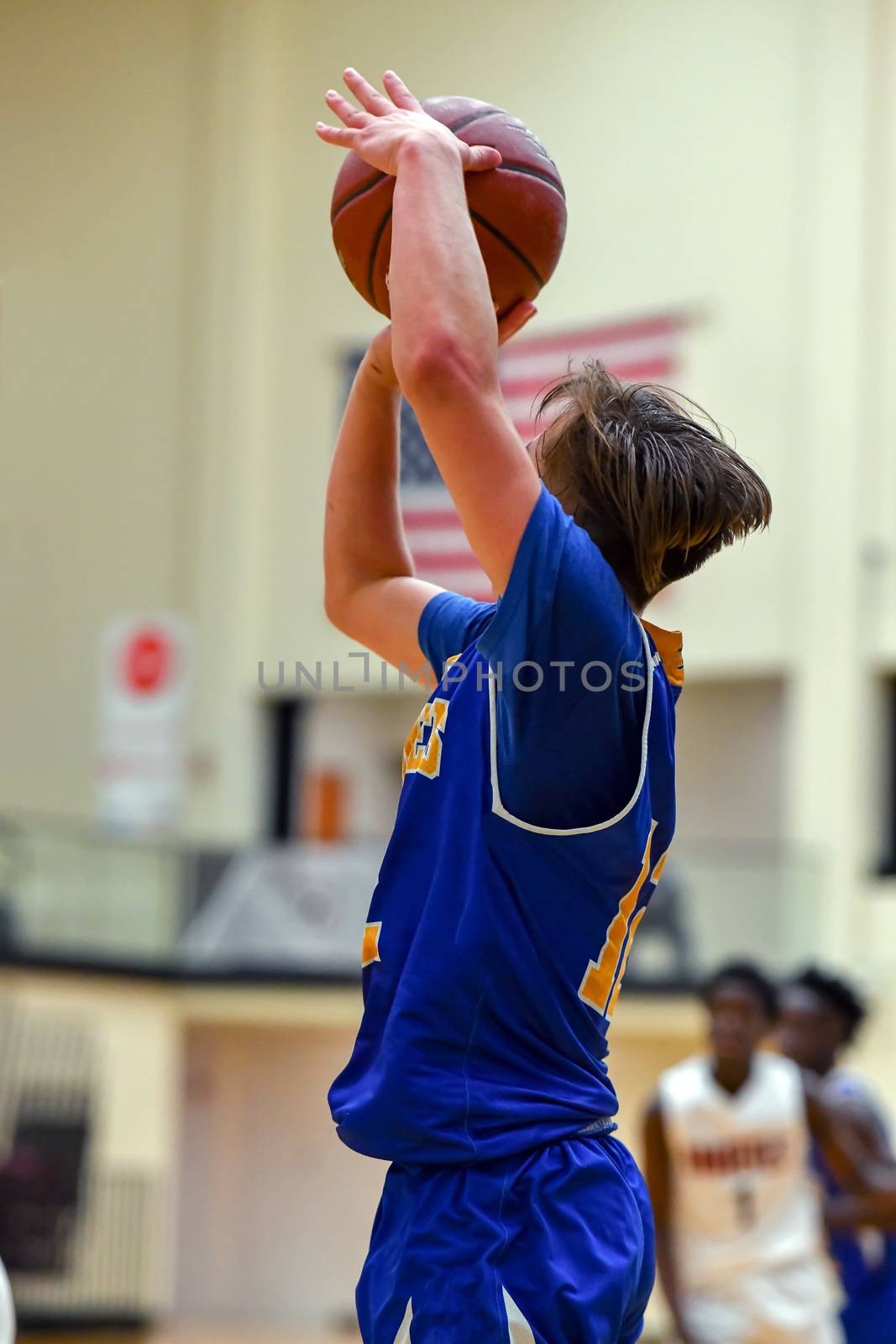 Young athletes making great basketball plays during a game. Slam Dunks and layups