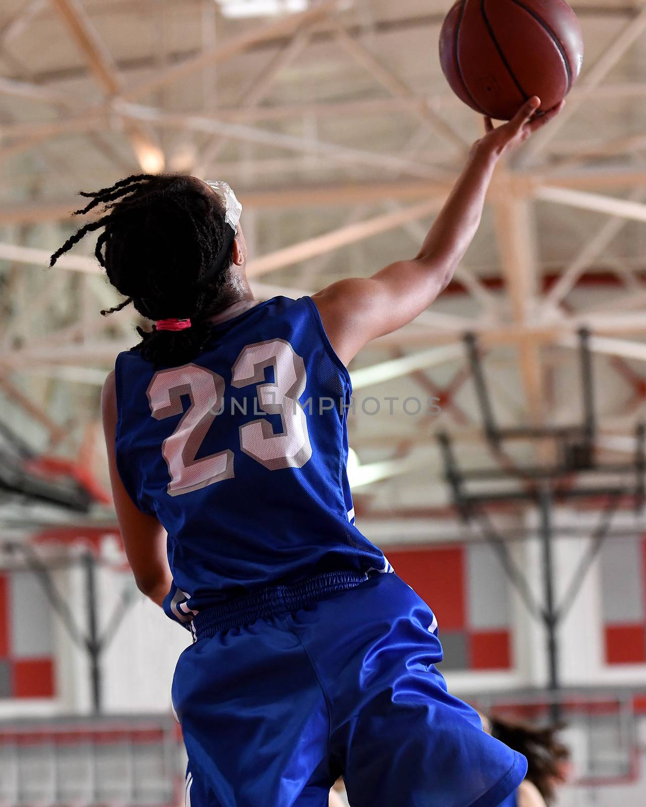 Young athletes making great basketball plays during a game. Slam Dunks and layups