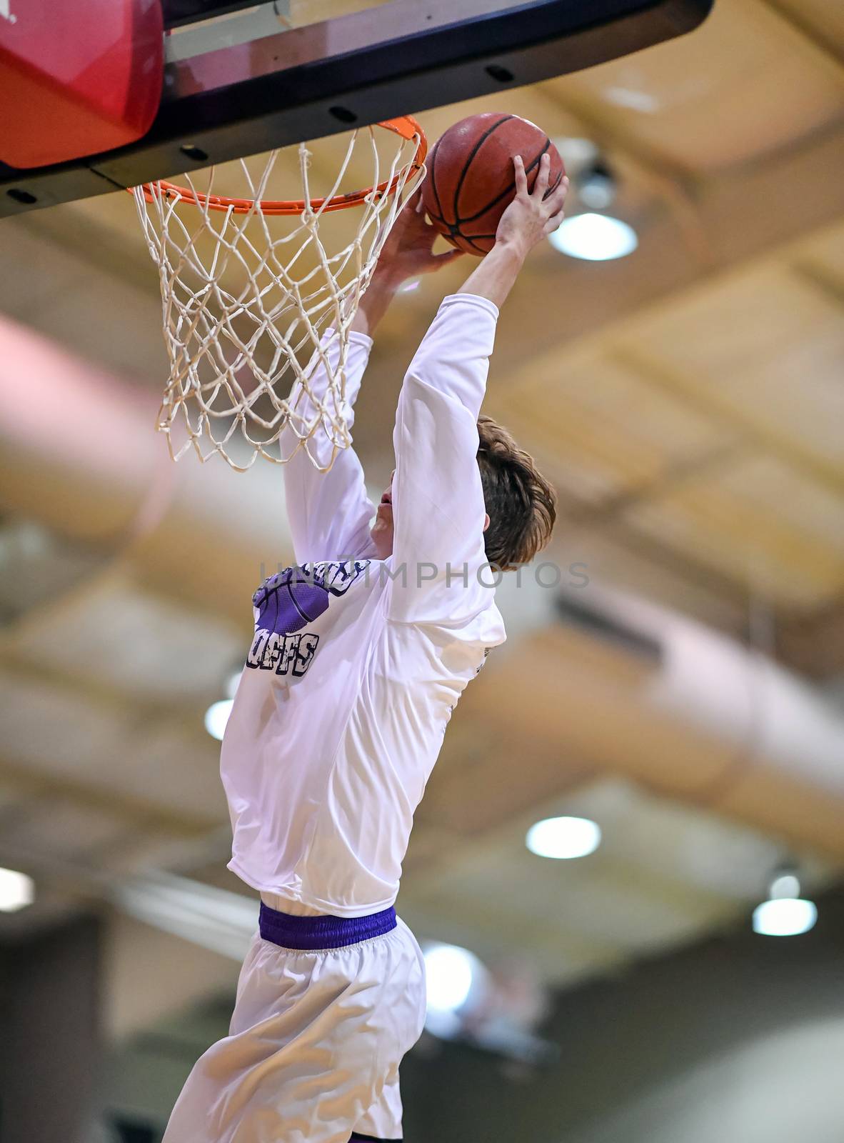 Young athletes making great slam dunks and lay ups during a basketball game