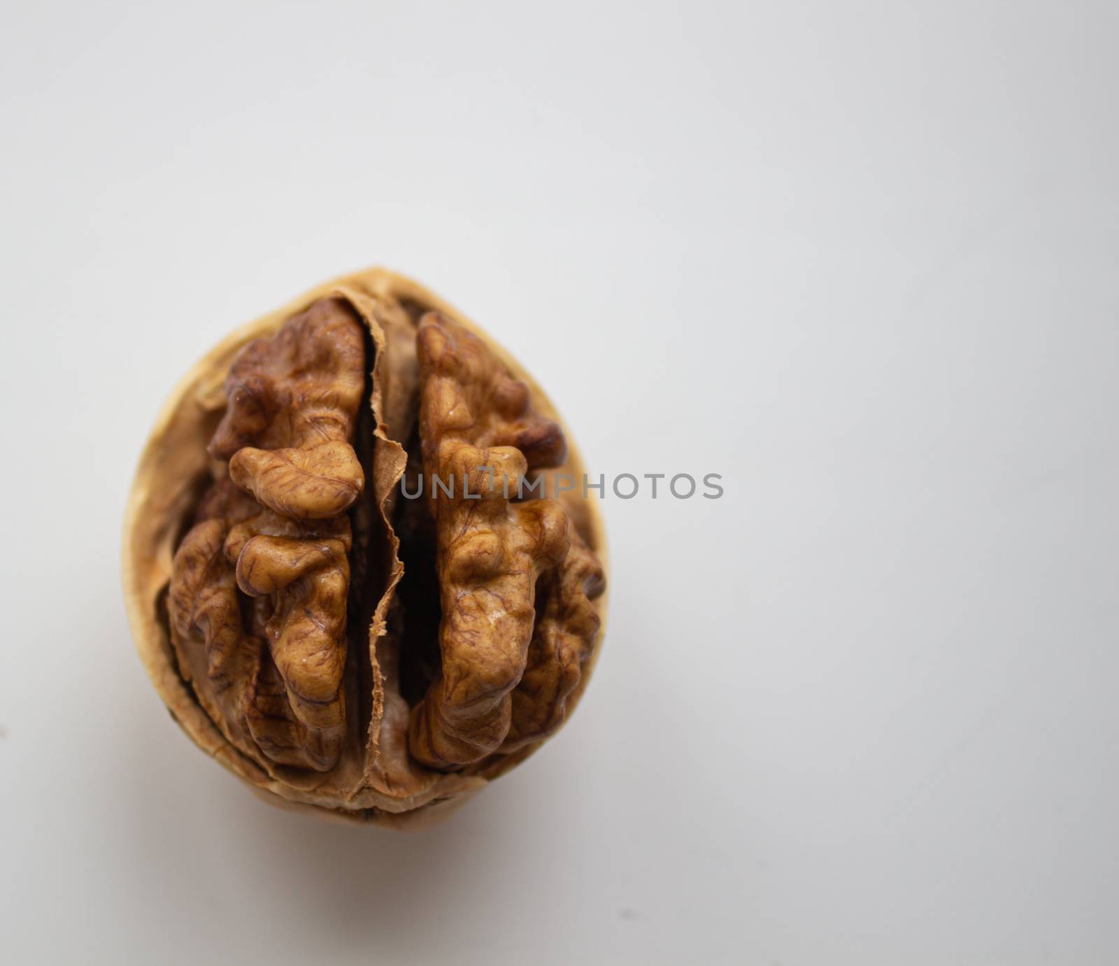 Cracked walnuts isolated on white background