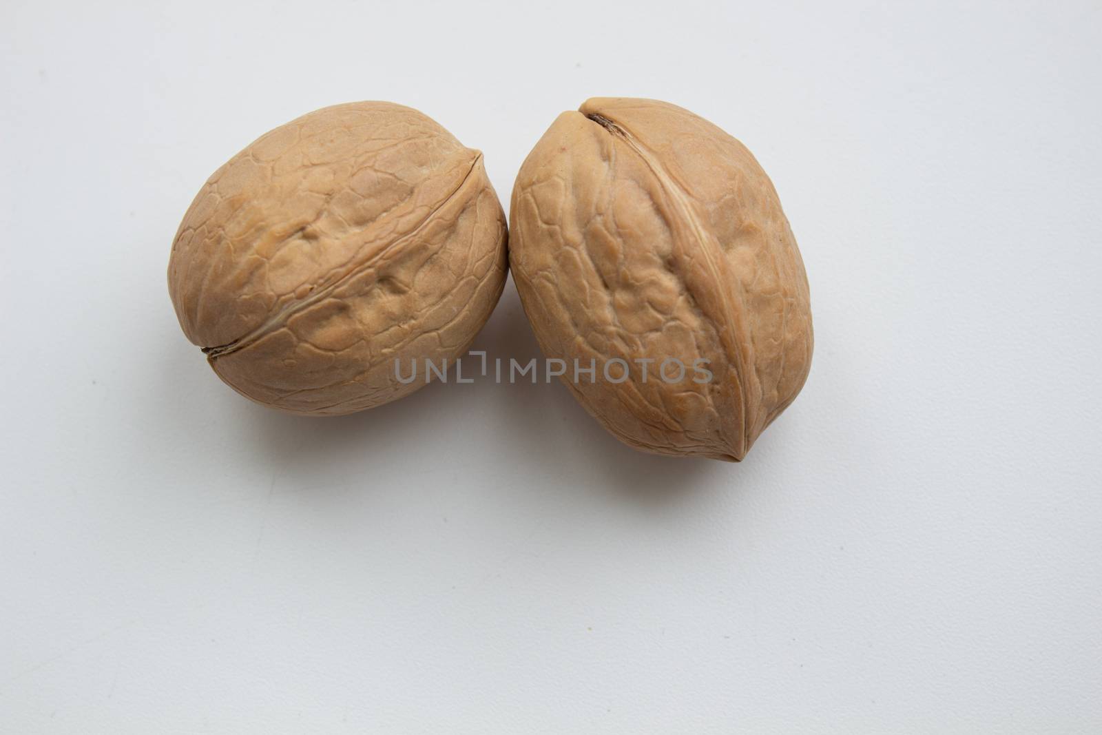 Cracked walnuts isolated on white background