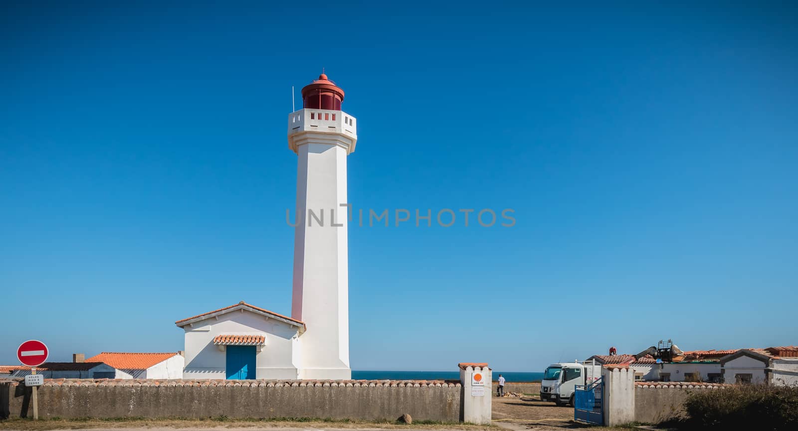 Port Joinville, France - September 17, 2018 - Architectural detail of the Corbeaux Marine Lighthouse on a summer day