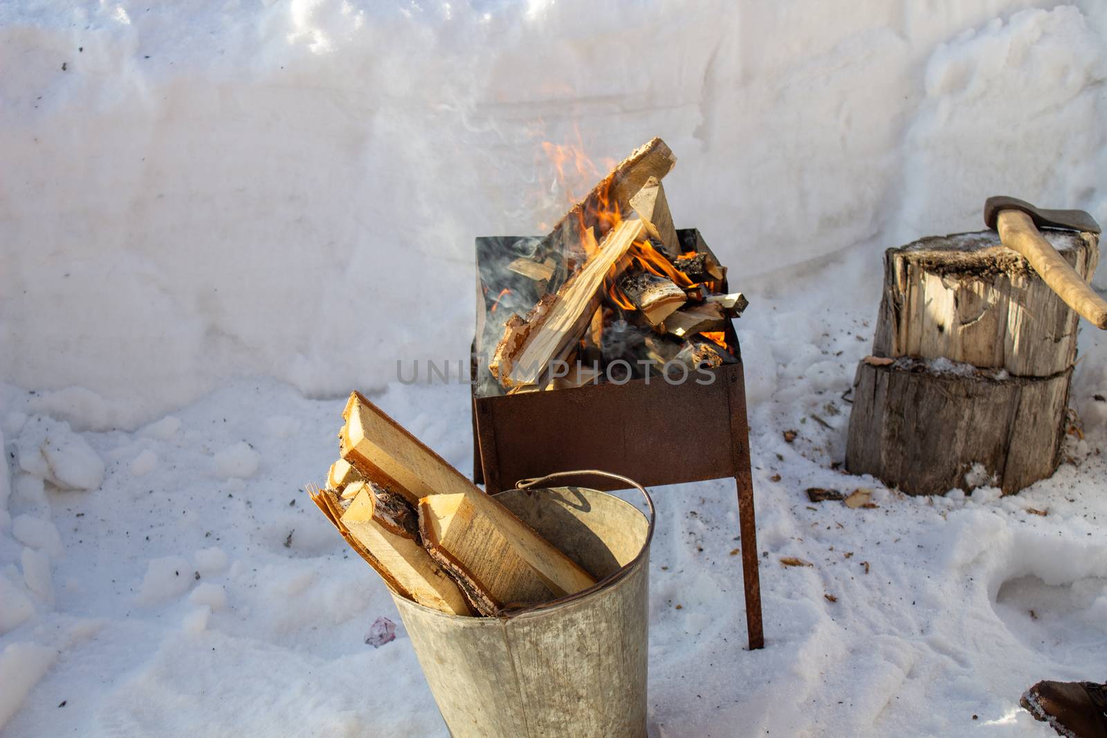 Barbecue with wood in winter on the street. Fry kebabs by AnatoliiFoto