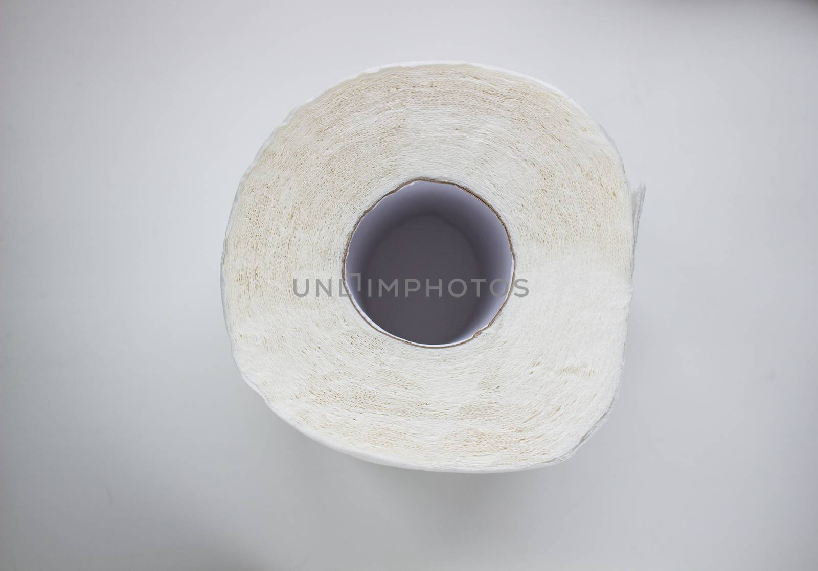 A roll of toilet paper on white background.