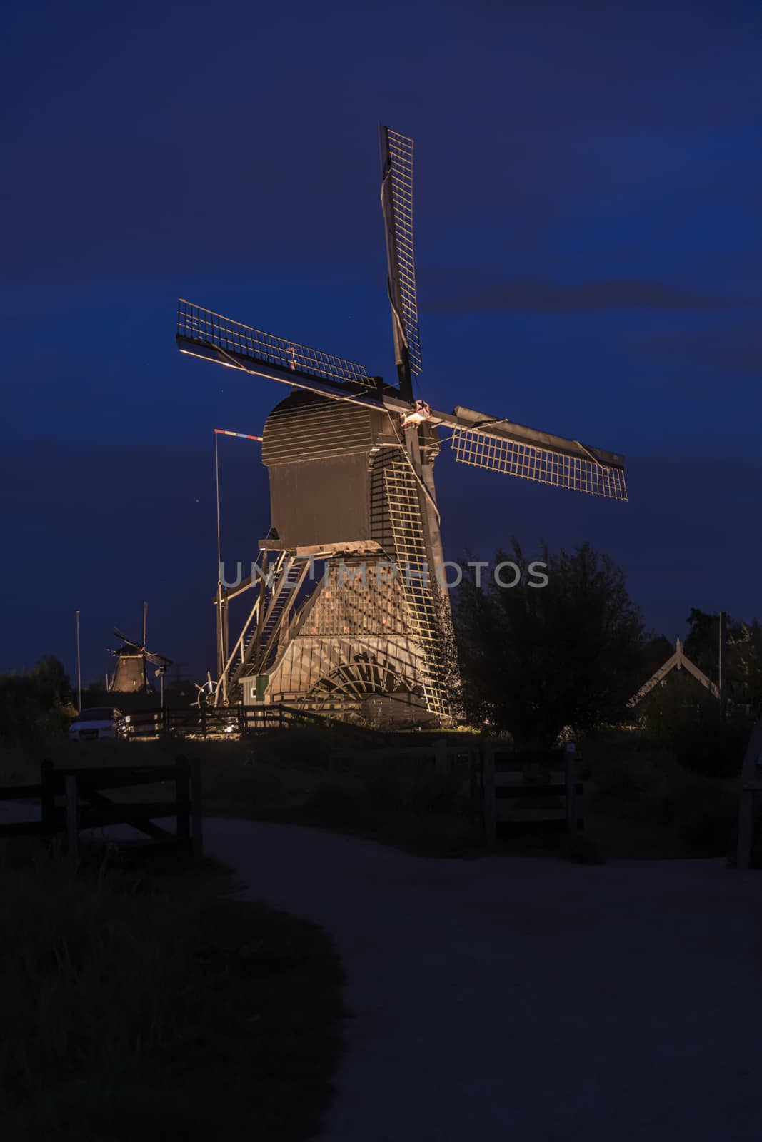 Majestic windmill against the bleu hour sunset in Alblasserdam city, Netherlands by ankorlight