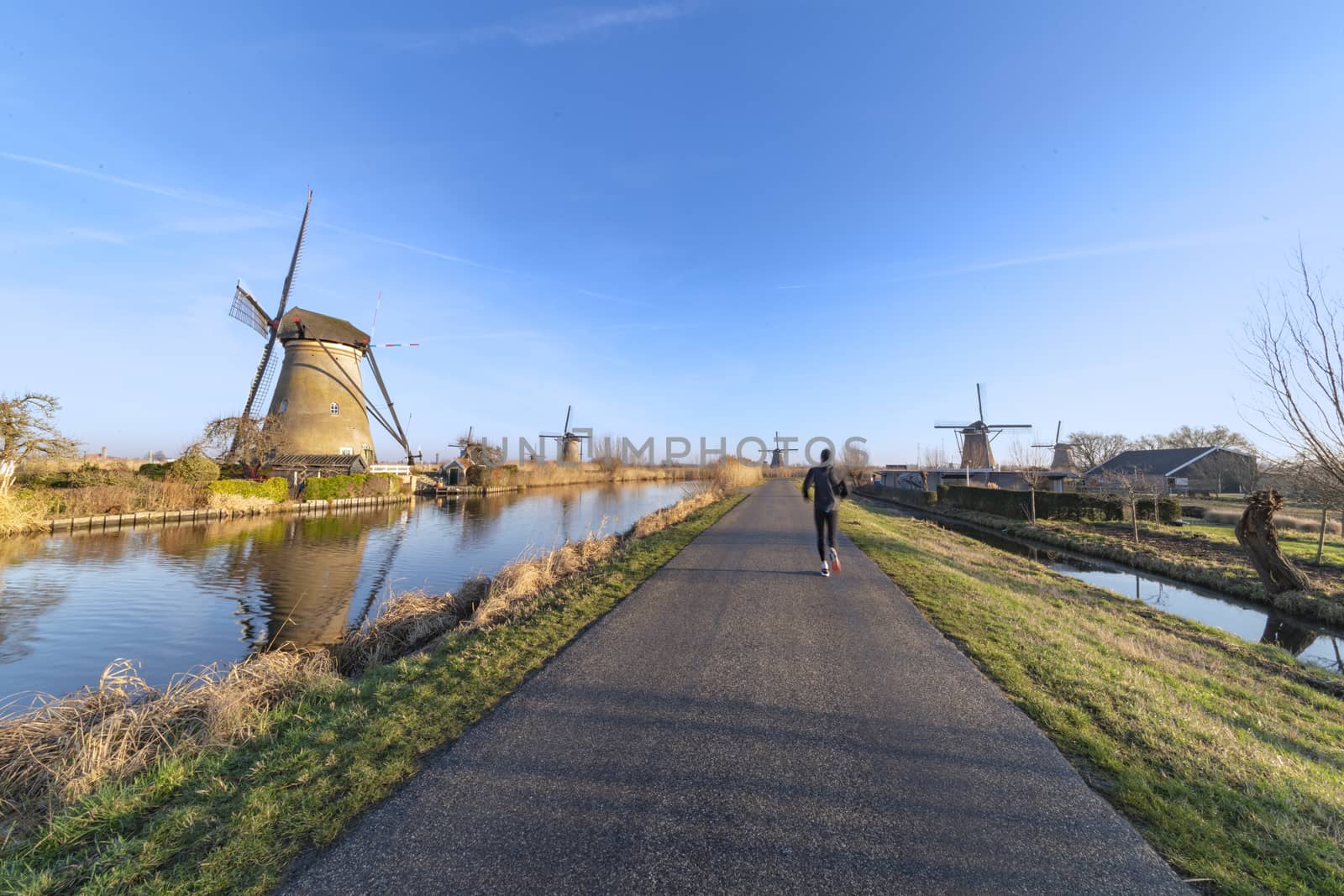 Twight light sunrise on the Unesco heritage windmill silhouette at the middle of the canal, Alblasserdam, Netherlands