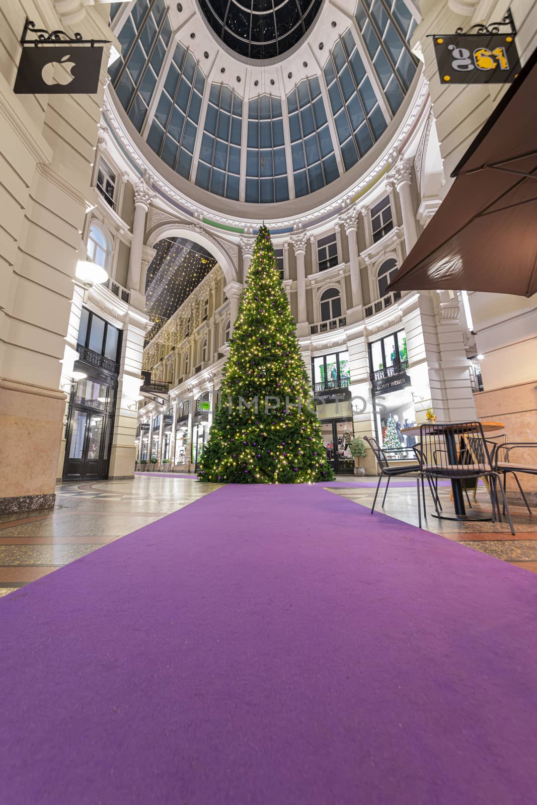THE HAGUE, 30 December 2019 - Christmas tree in De Passage shopping mall at night after a crowded and busy shopping time, Netherlands

