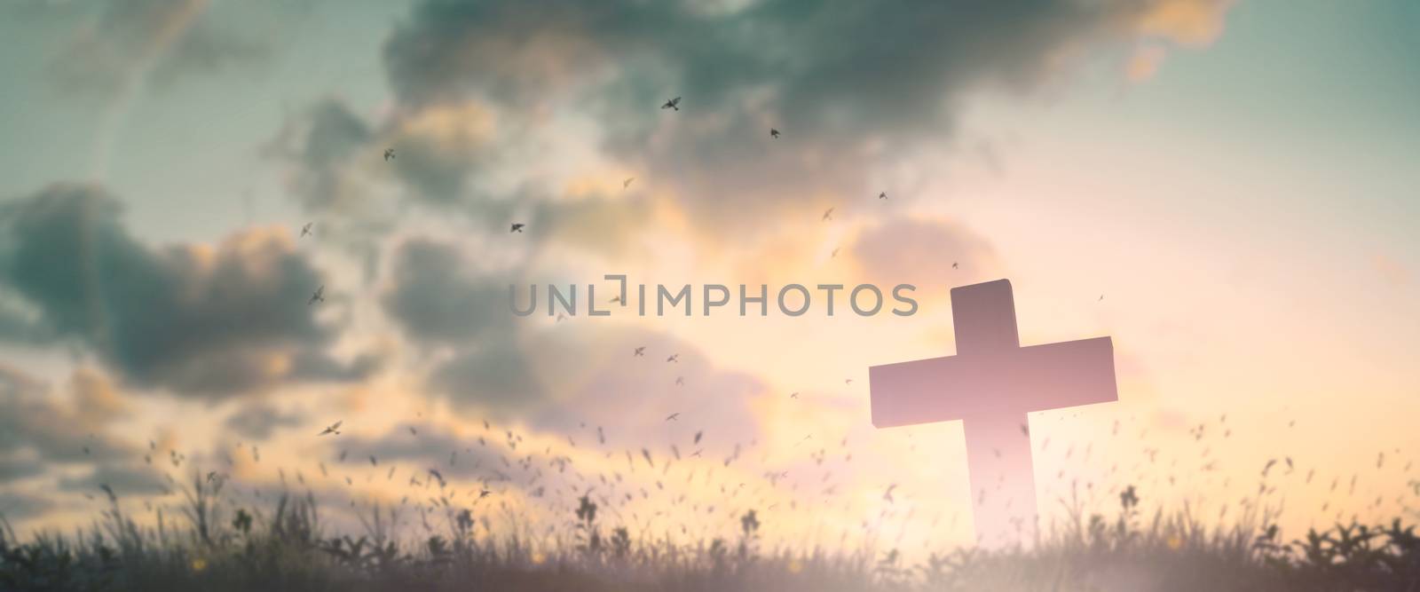 Silhouette jesus christ crucifix on cross on calvary sunset background concept for good friday he is risen in easter day, good friday jesus death on crucifix, world christian and holy spirit religious.