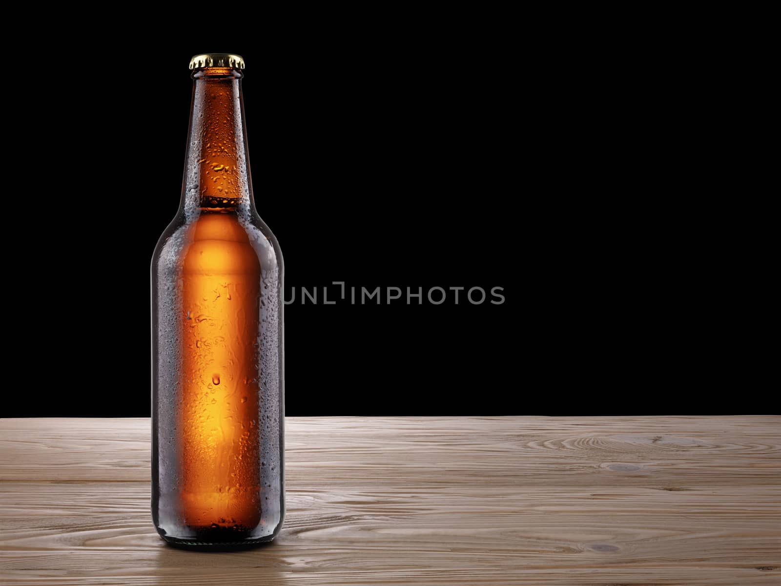 Ful, sealed brown bottle of beer standing on rustic wooden table. Mockup. Clipping paths for both bottle and background. Infinite depth of field