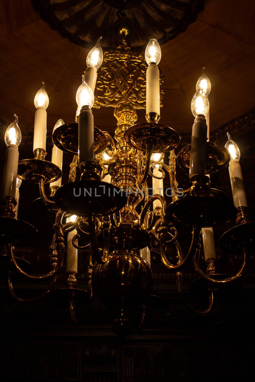 Beautiful chandelier with light bulbs in the Palace. by AnatoliiFoto