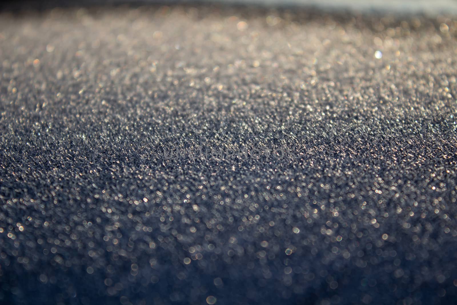 Frost on the car. Details of the car. Getting the sun and frost. Early spring Sunrise Morning