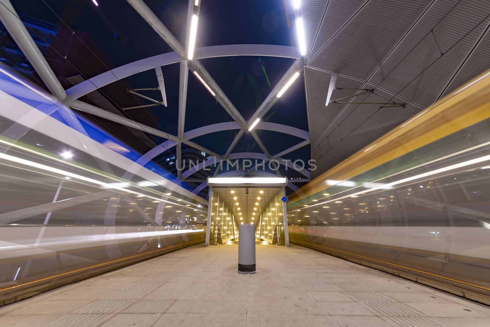 The Hague Beatrixkwartier tram station platform illumated at night waiting for passengers during the blue hour, The Hague, Netherlands