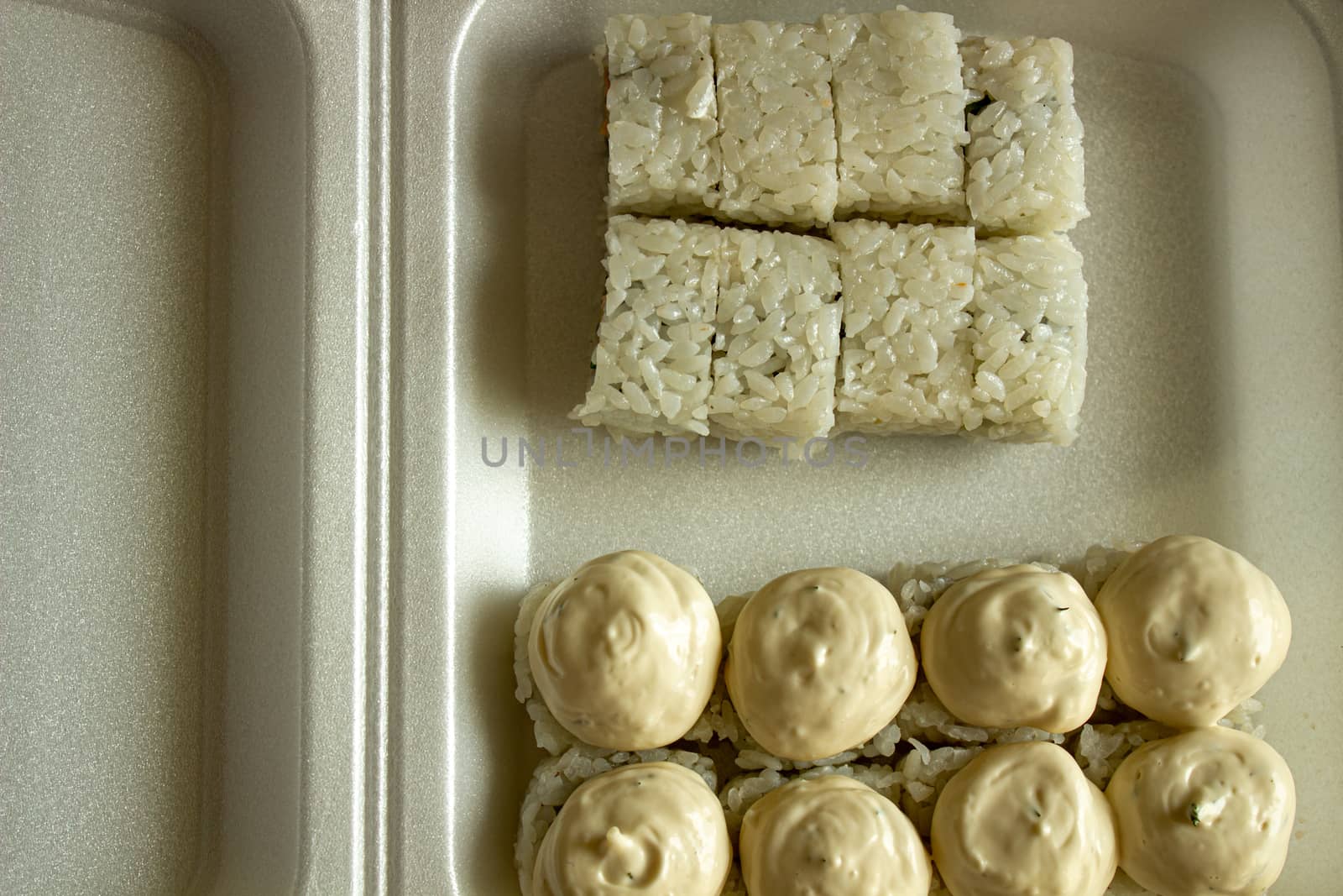 Different sushi in a take-away package. Japanese food.