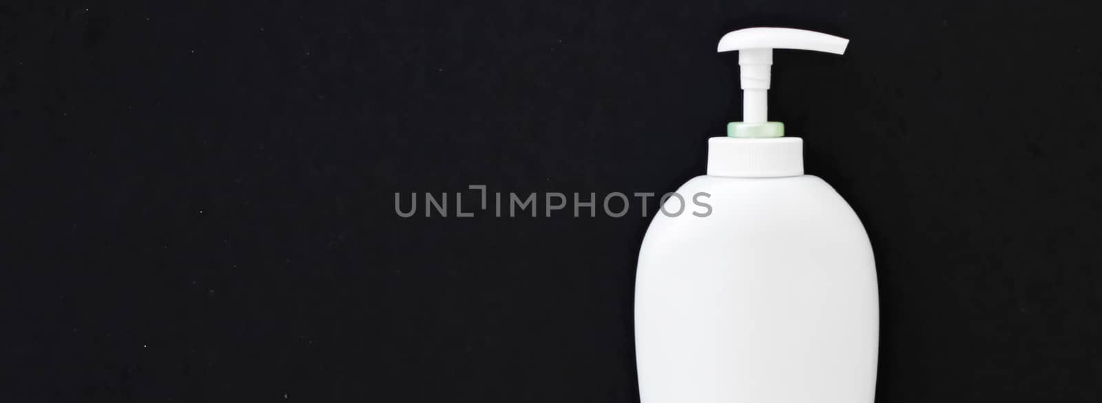 Blank label cosmetic container bottle as product mockup on black background, hygiene and healthcare