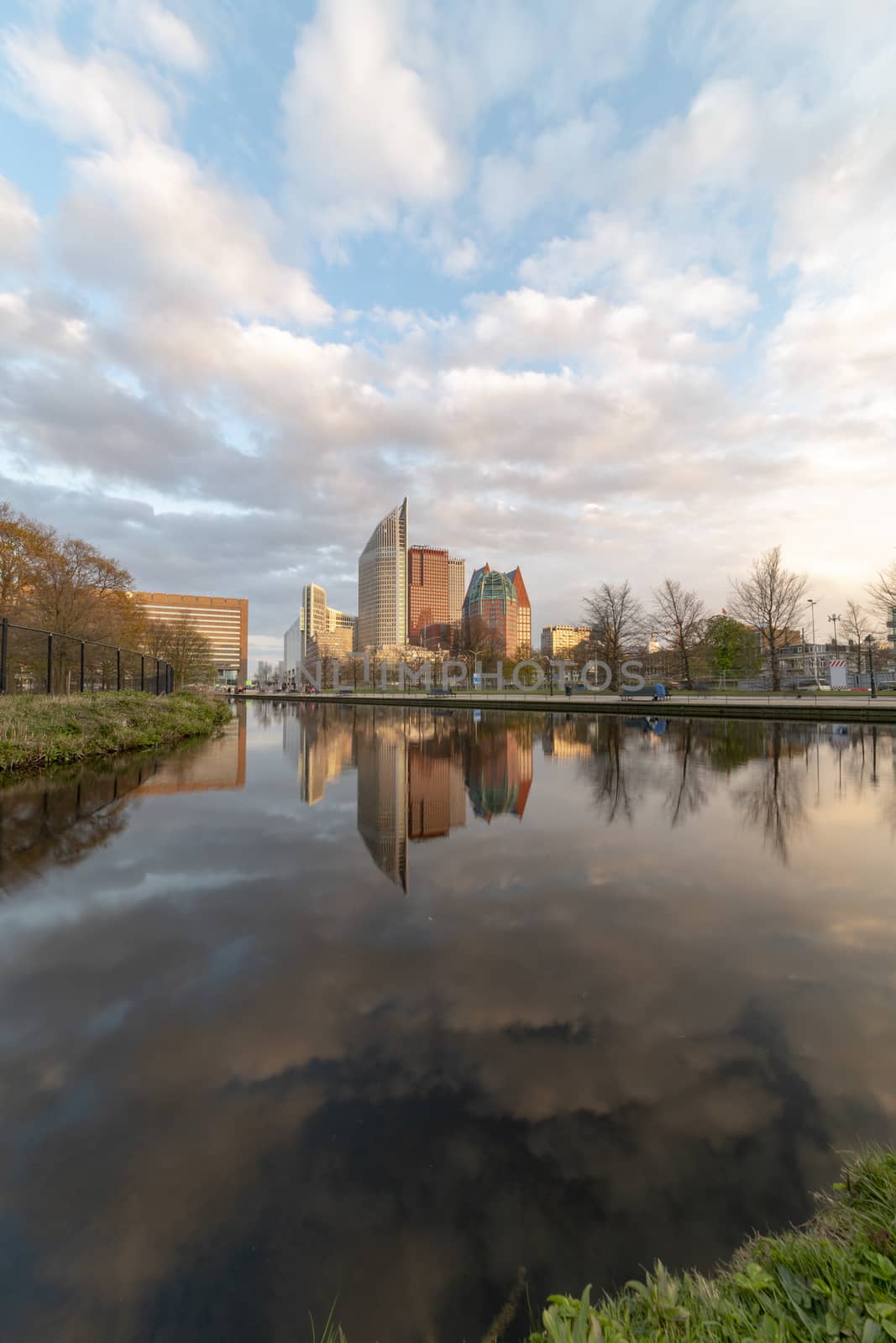 Sunrise on The Hague cityscape reflected on the water at the spring season by ankorlight