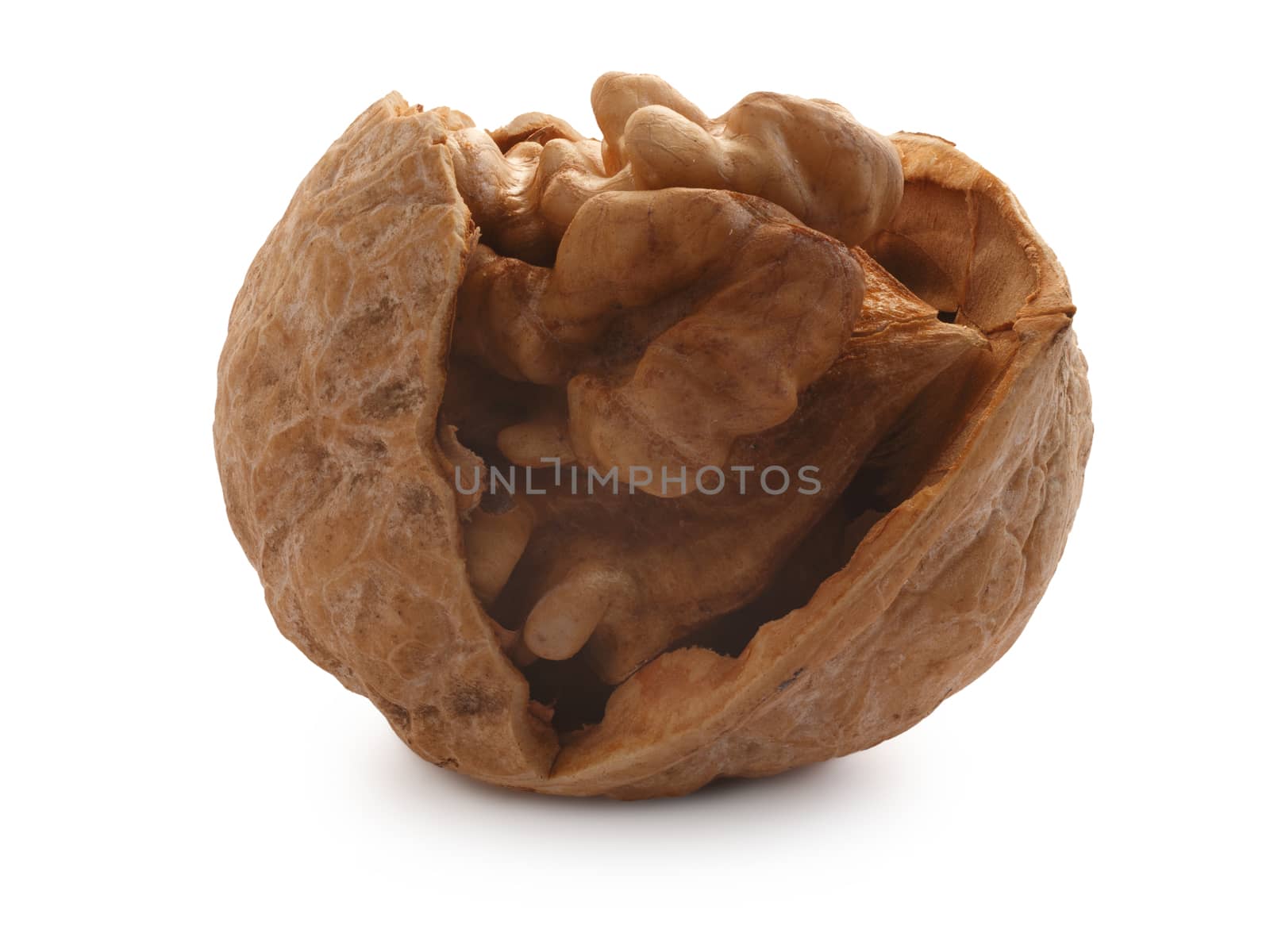 Singlehalf-cracked walnut (edible seed of tree of Juglans regia). Clipping paths for both nut and shadow, infinite depth of field