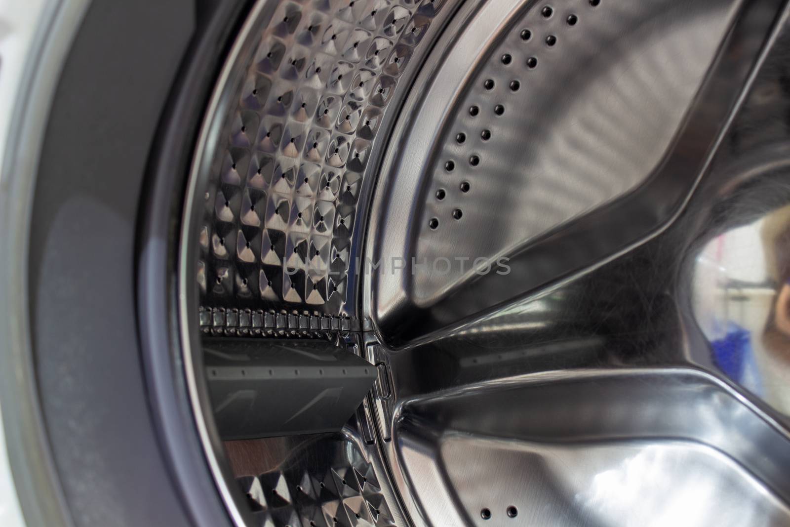 The drum of the washing machine. Details of the washing machine by AnatoliiFoto