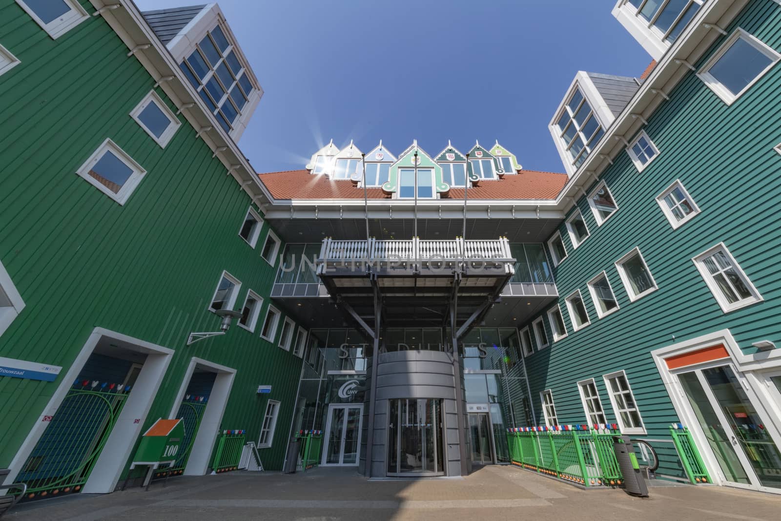 ZAANDAM, 14 April 2019 - Front view of the green entrance and bulding of Zaandam city hall 