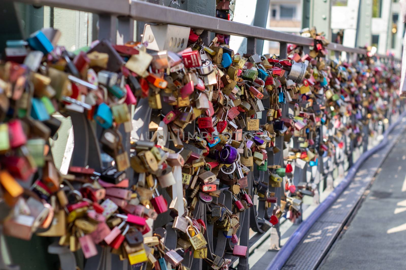 Padlocks on a bridge in Frankfurt am main, Germany. The ritual of attaching padlocks as a symbol of love to a bridge has been common in Europe since the 2000s.