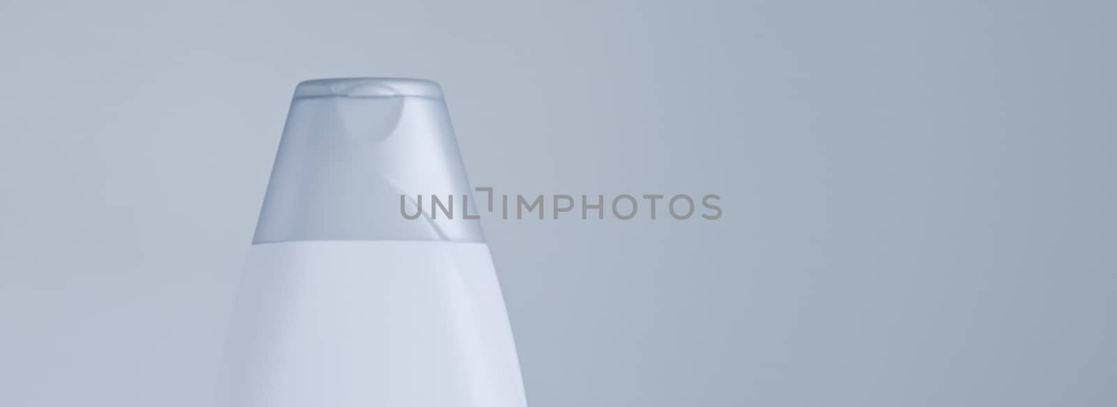 Blank label cosmetic container bottle as product mockup on gray background, hygiene and healthcare