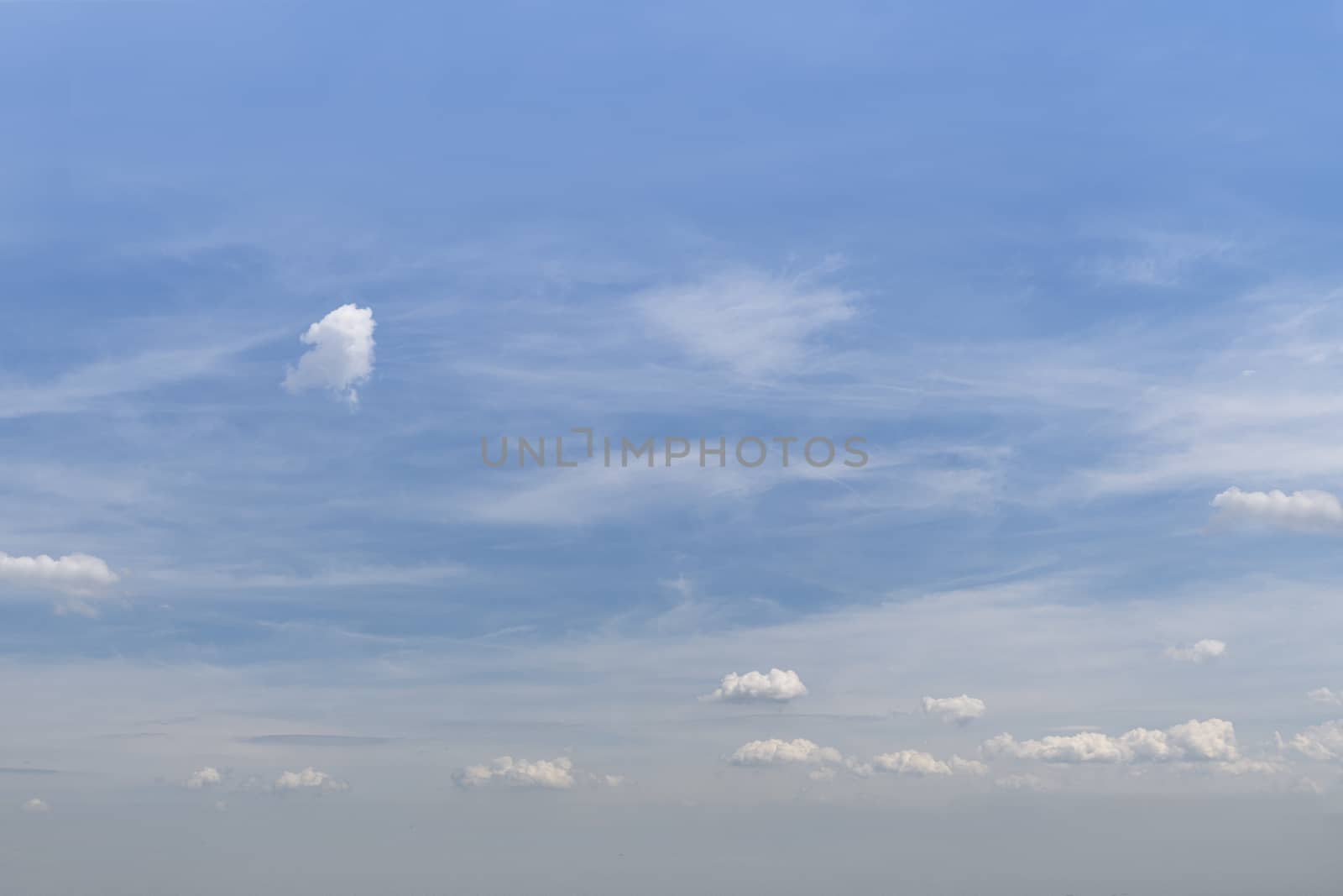 View of the beginning of the cumulonimbus clouds during the warm and wet weather with thick fog at the horizon by ankorlight