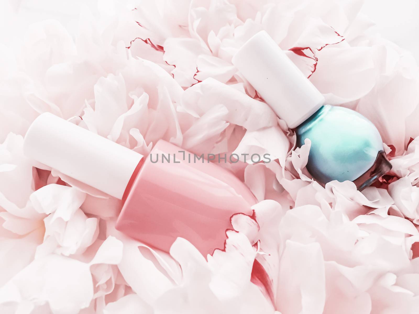 Nail polish bottles on floral background, french manicure and cosmetic branding by Anneleven