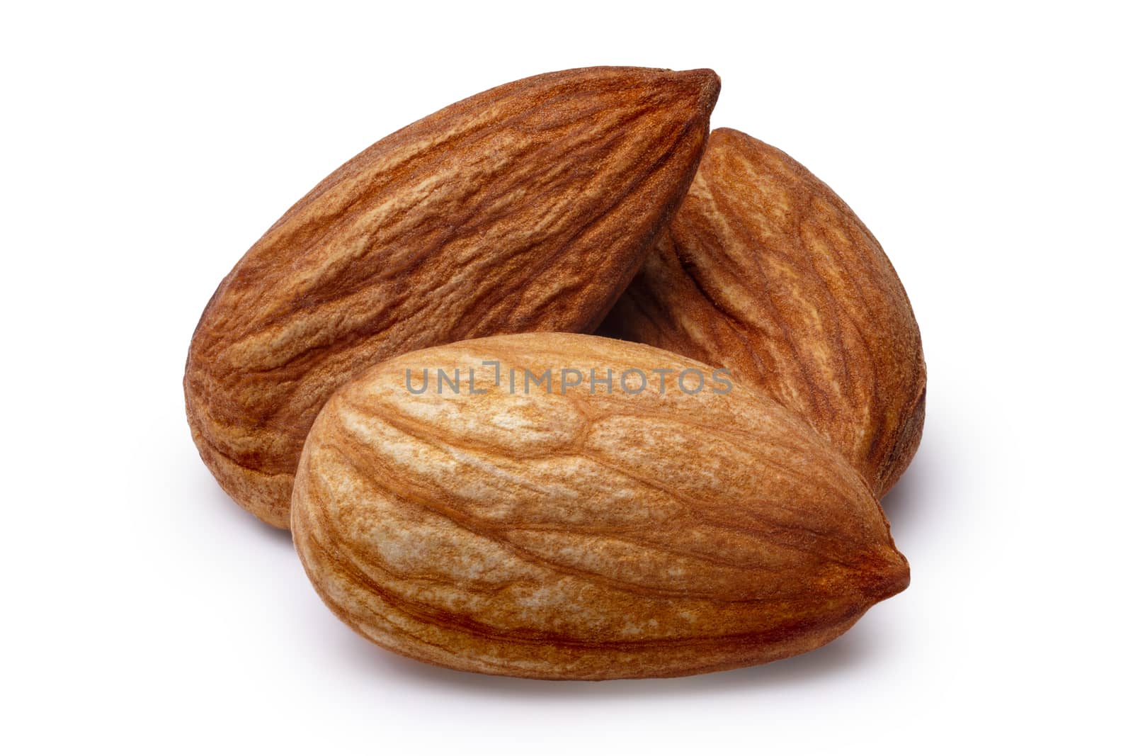 Three shelled almonds (fruits of Prunus amygdalus). Infinite depth of field,clipping paths
